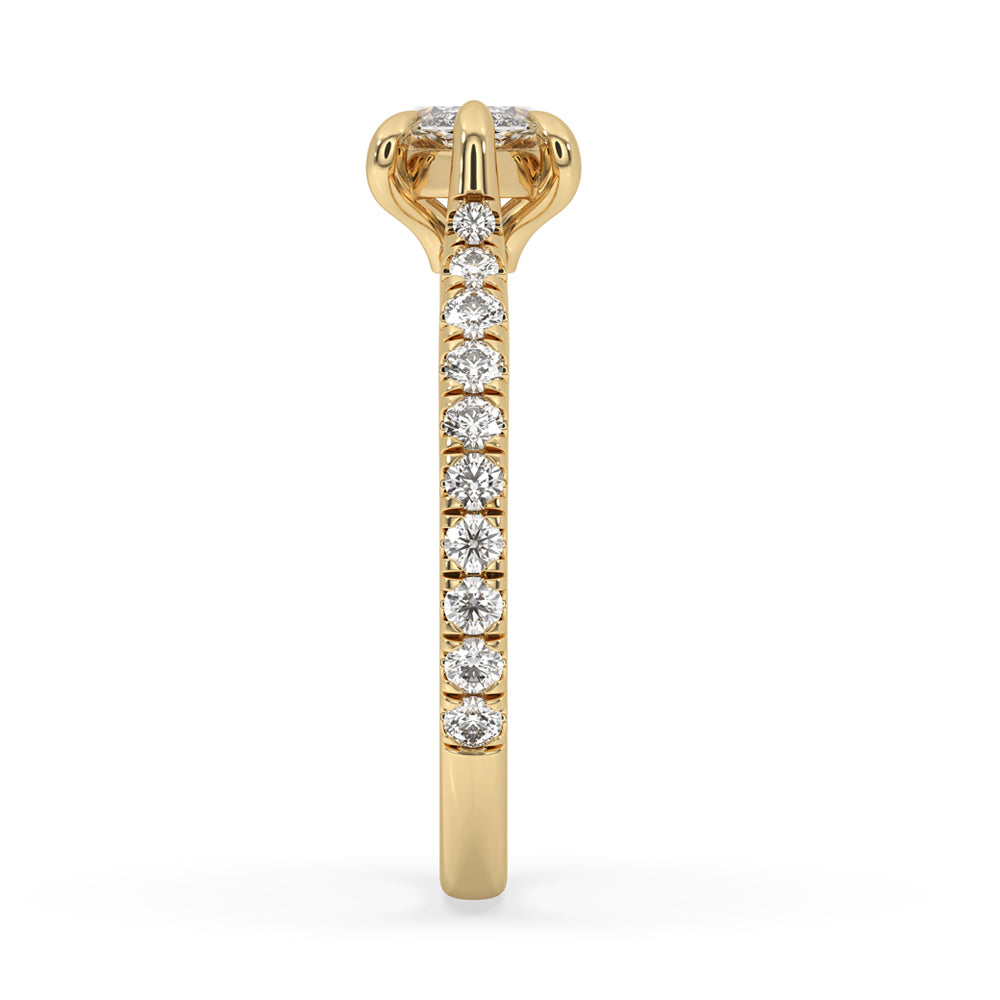 Round diamond pave setting with tapered pave set in yellow gold.
