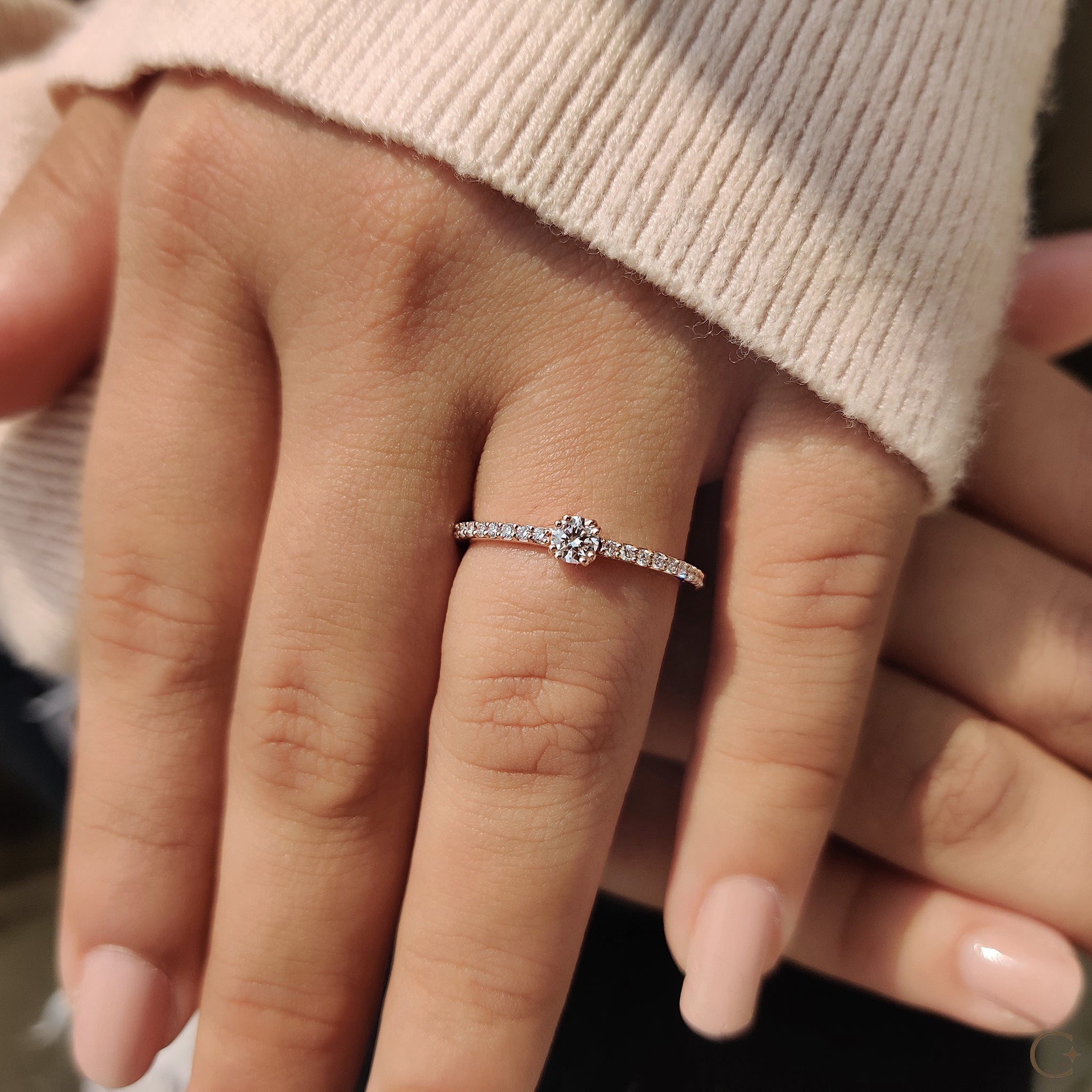 A rose gold diamond ring with shine
