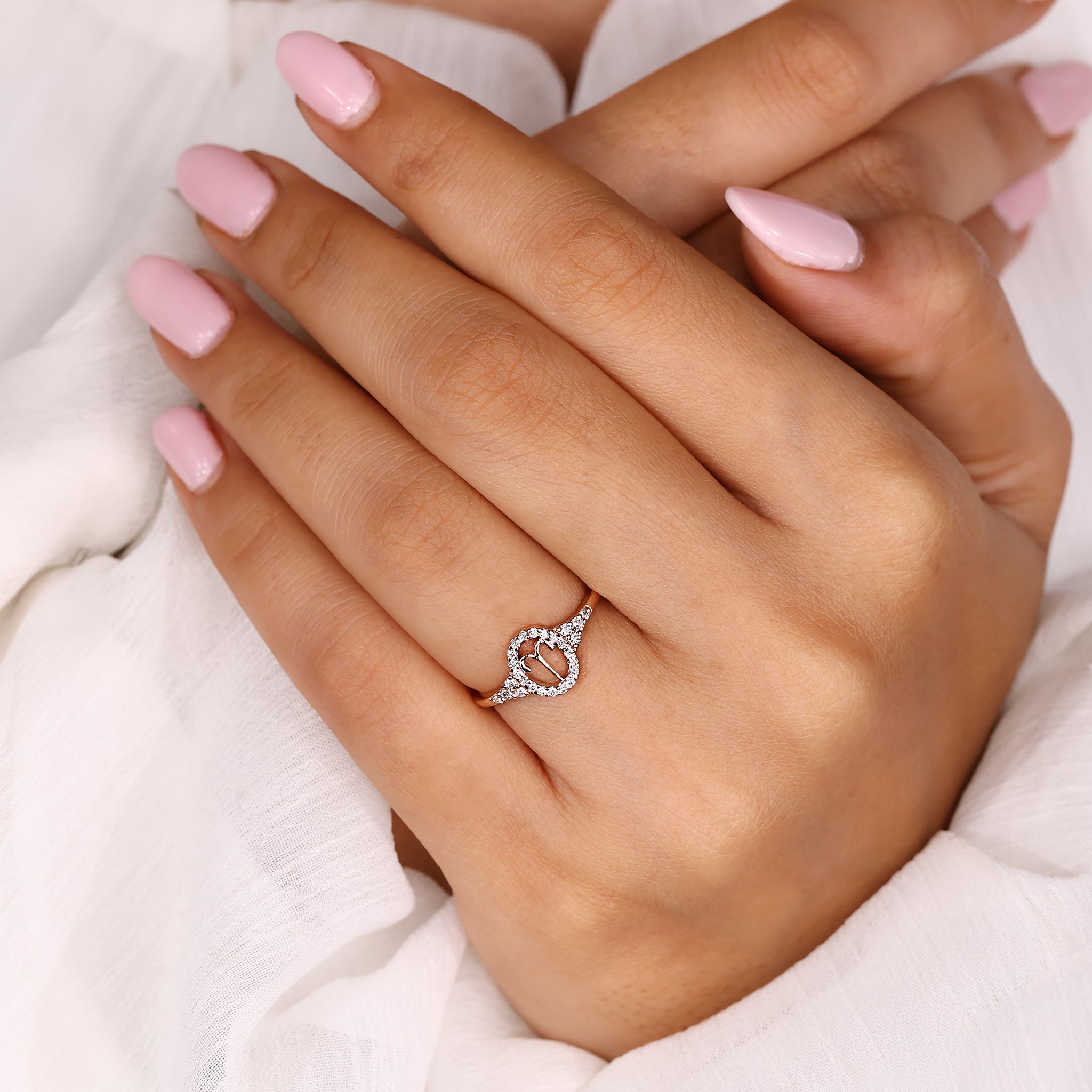 Custom zodiac ring with Aries horoscope design in rose gold finish.
