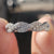 Twisted eternity band with a flowing design, crafted to symbolize never-ending love in a modern style.