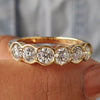 Half Eternity Wedding Band in yellow gold with 6 stone round cut design.
