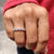 Moissanite wedding band shining with brilliant clarity.