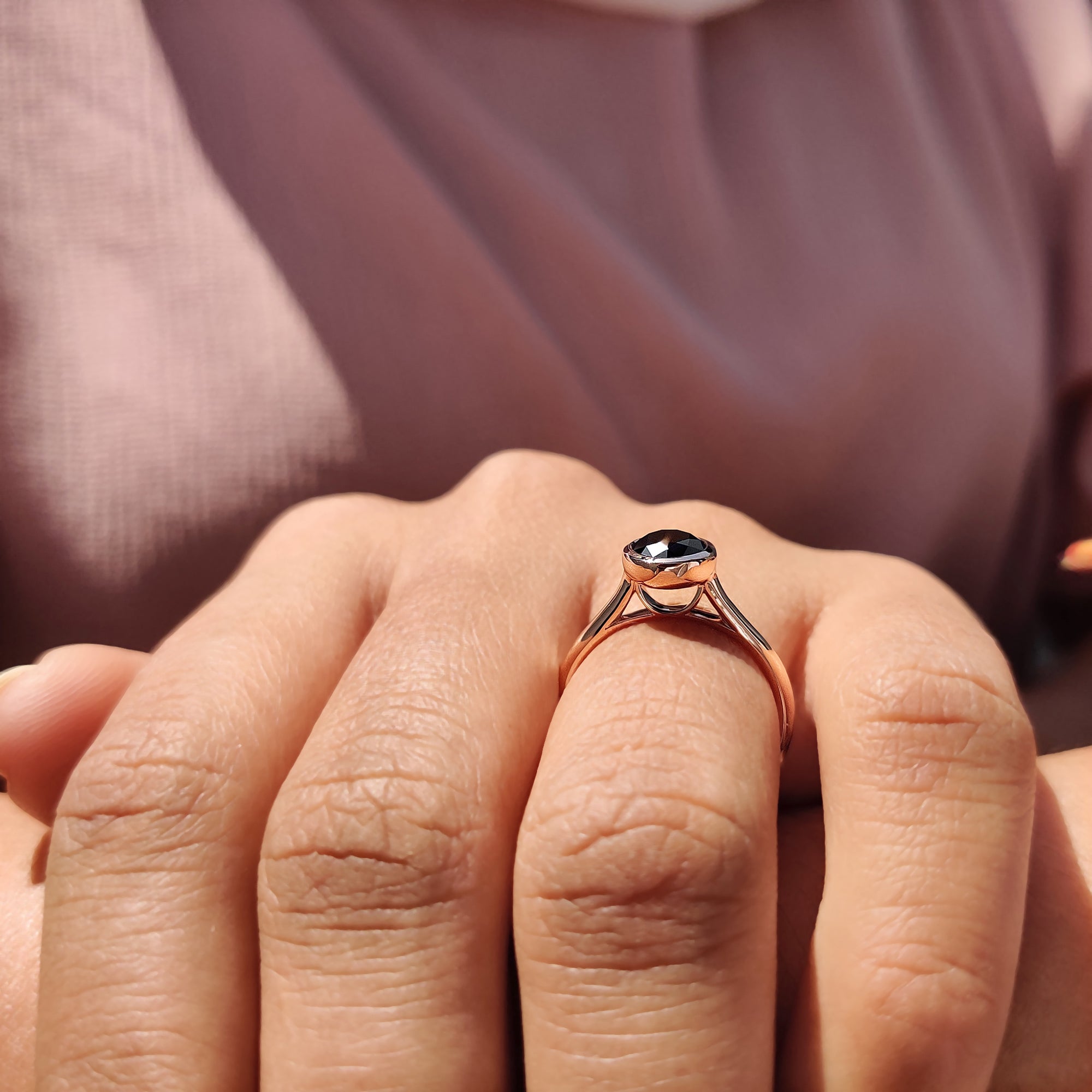Bezel setting ring with a black Moissanite centre stone, perfect as a unique engagement ring.
