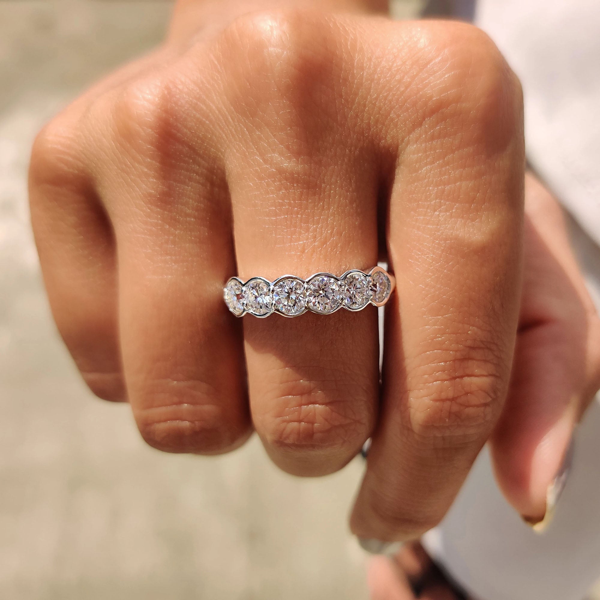 Custom wedding band with bezel settings made to match your personal style.
