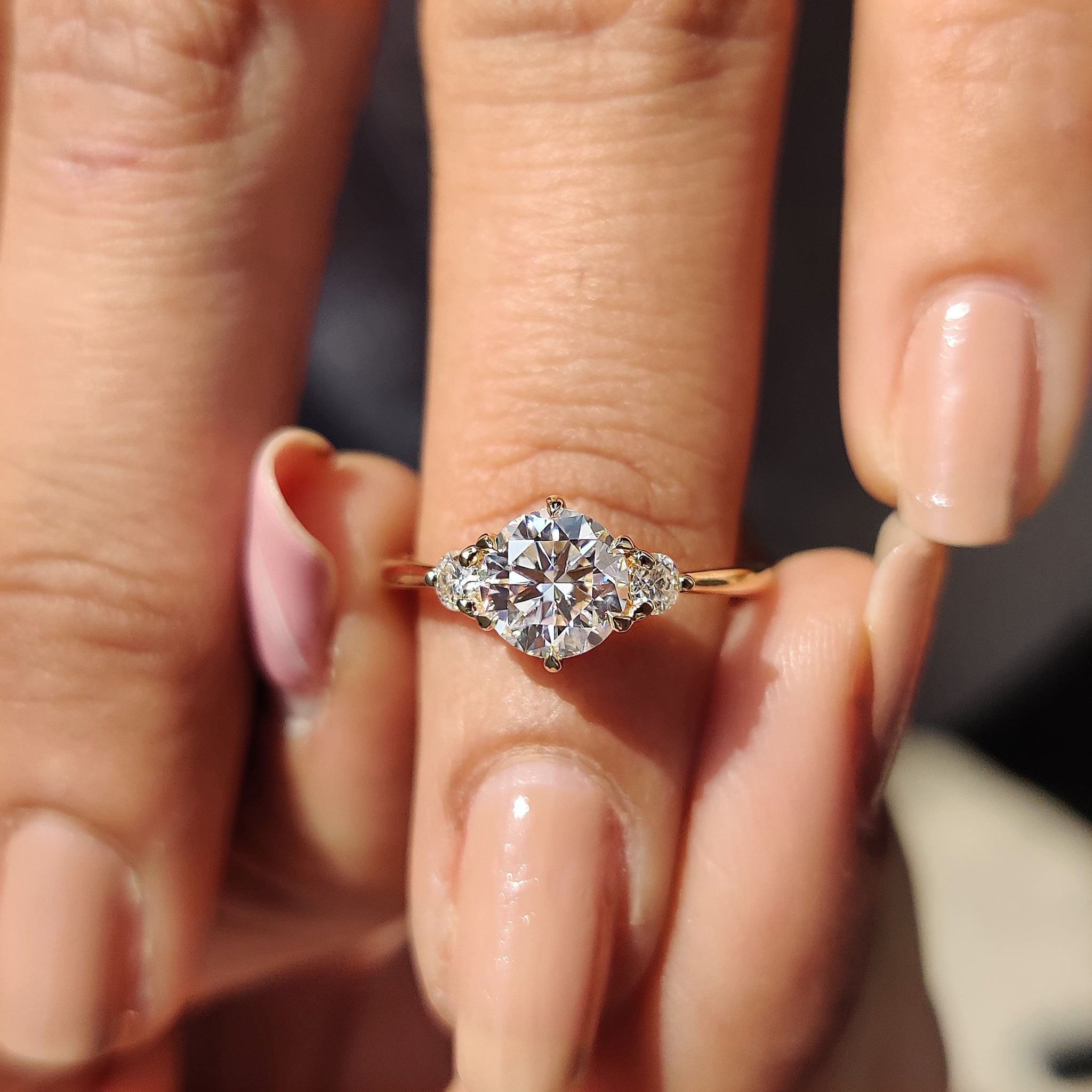 Round cut Moissanite in a custom engagement ring, crafted with precision and care.