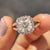 Cushion Cut  ring with a halo setting in rose gold, perfect as a custom engagement ring for a memorable proposal.
