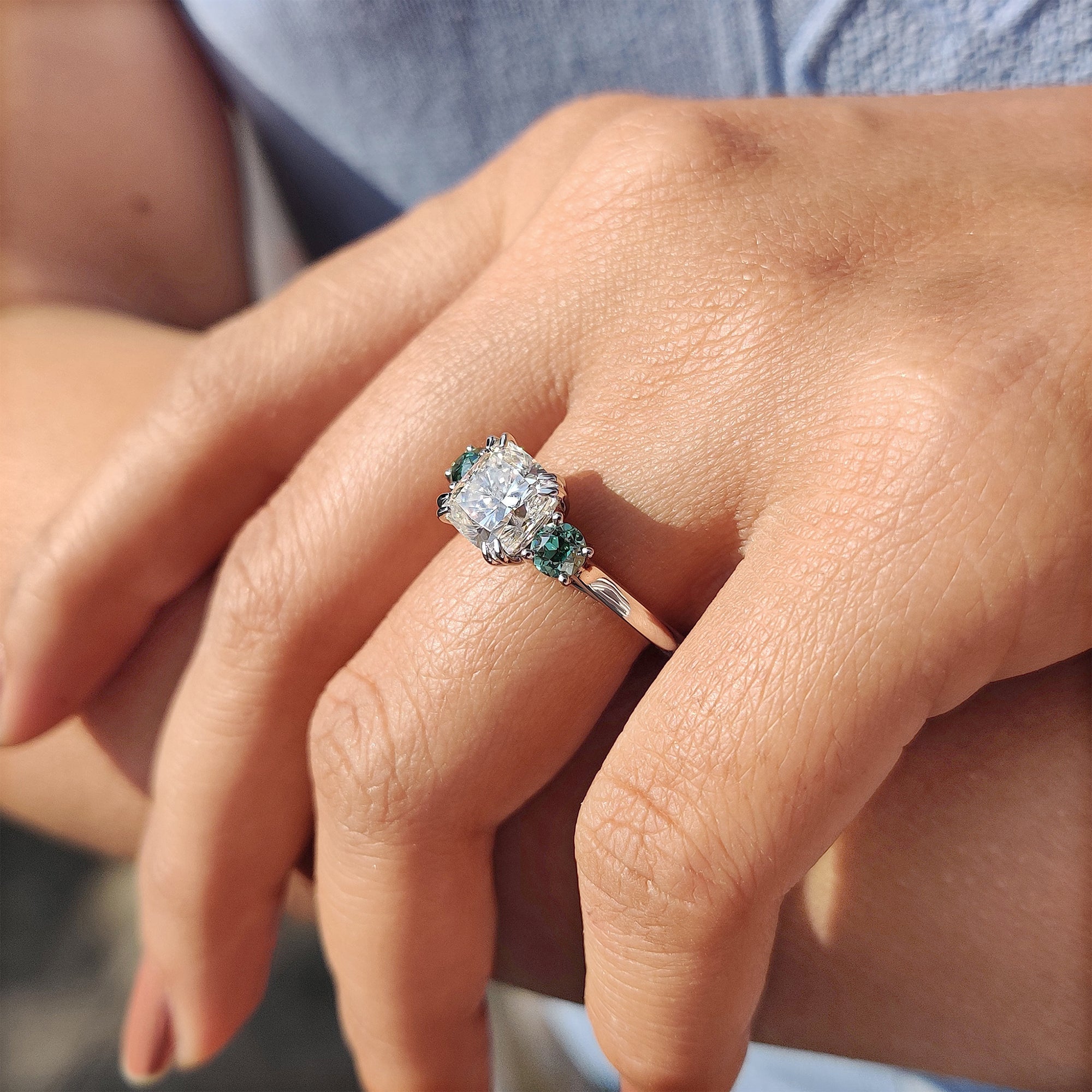 Custom Moissanite engagement ring with trellis setting.
