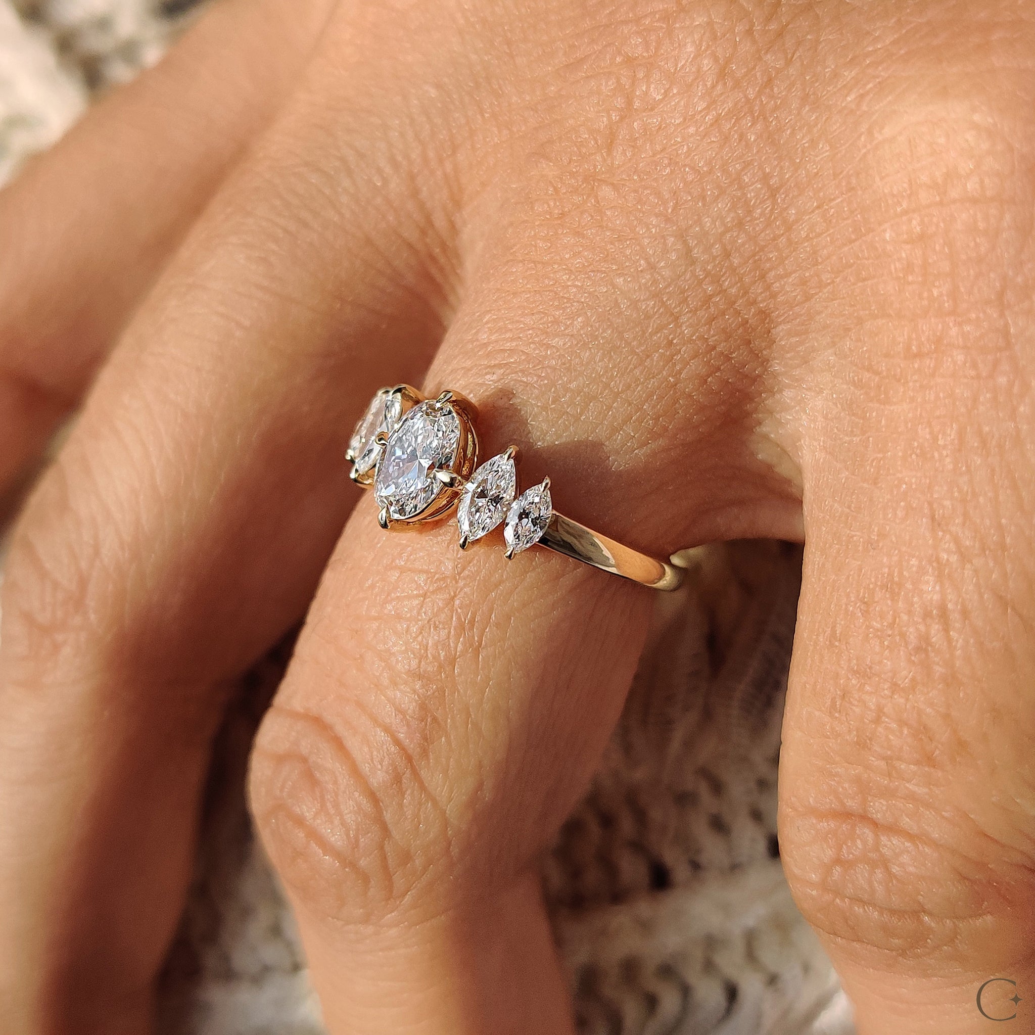 Diamond ring featuring a compass prong setting.

