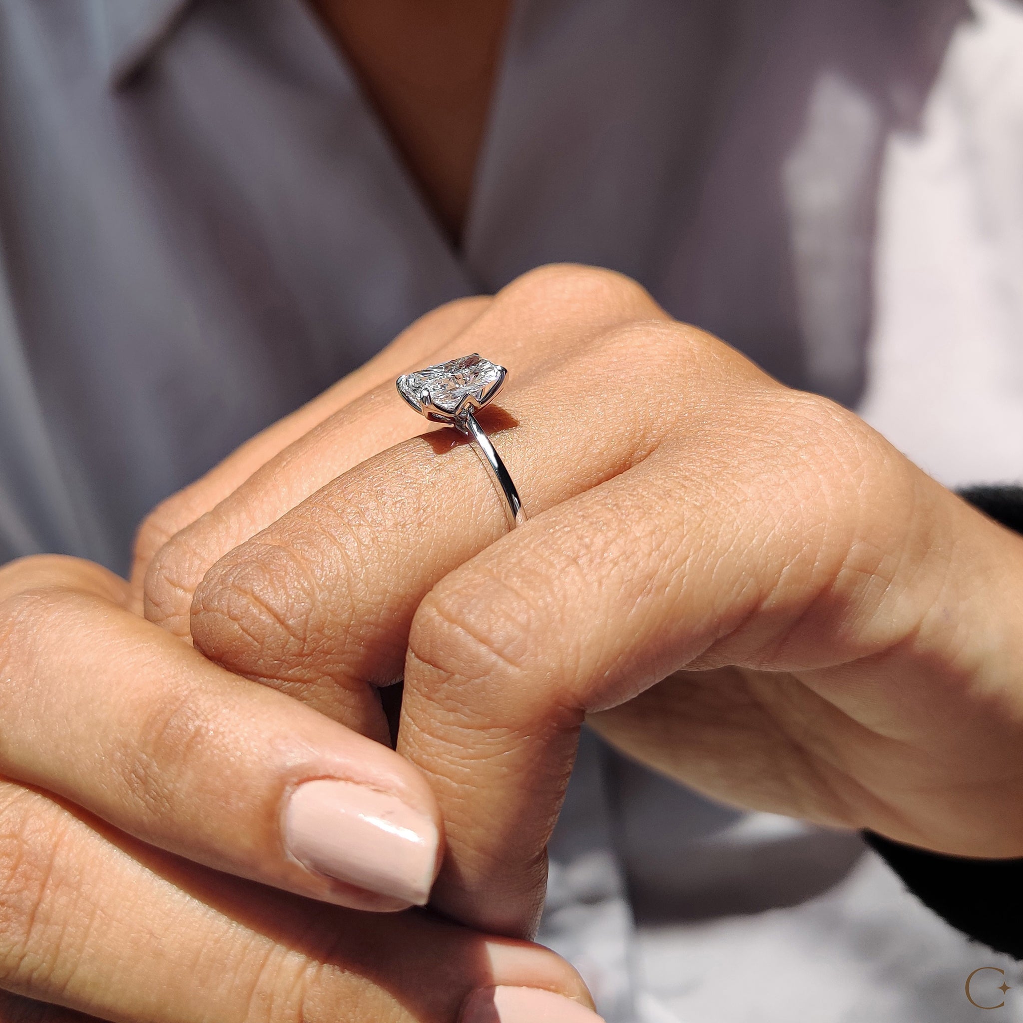 White gold diamond ring with a classic design.
