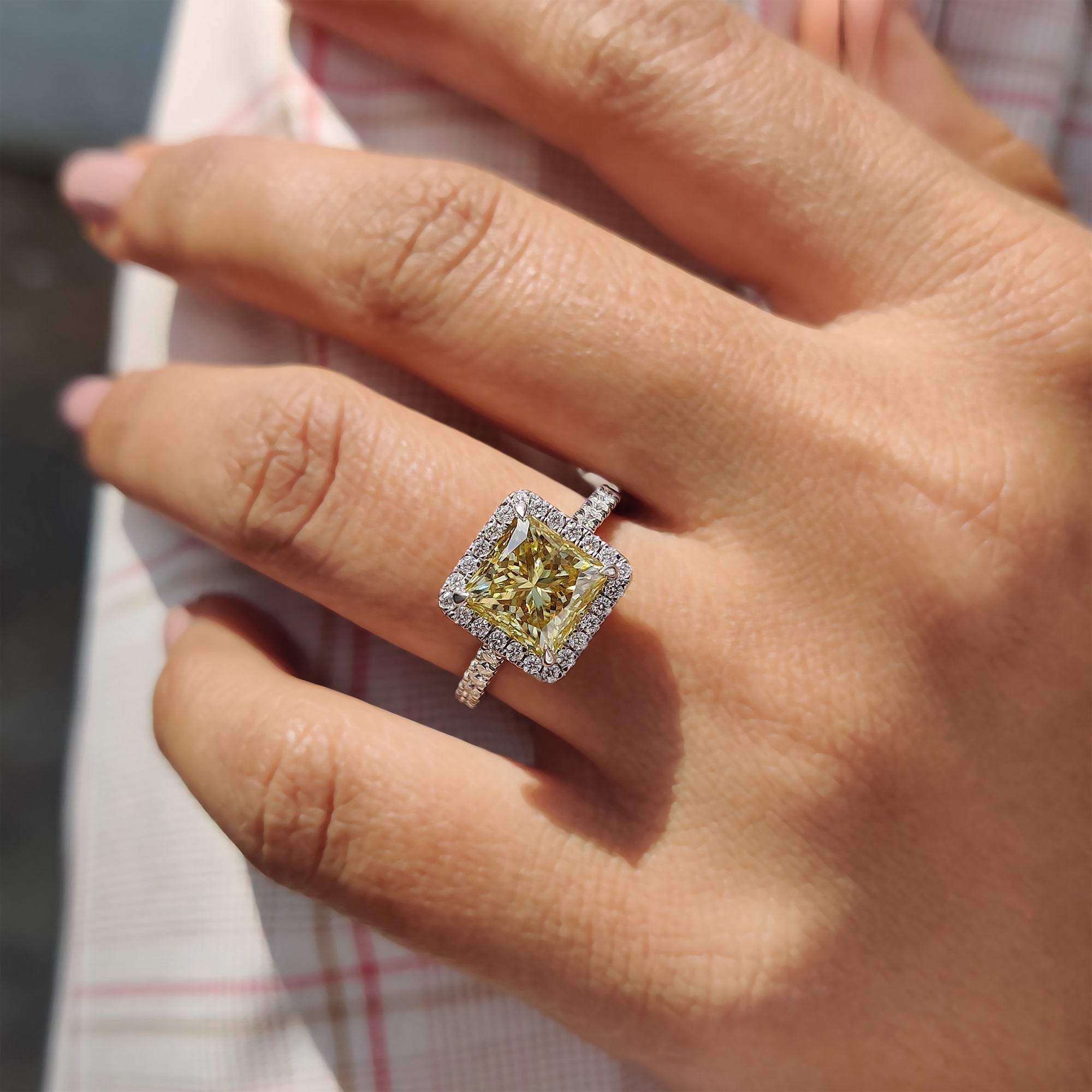White gold engagement ring brings sleek polished warmth.