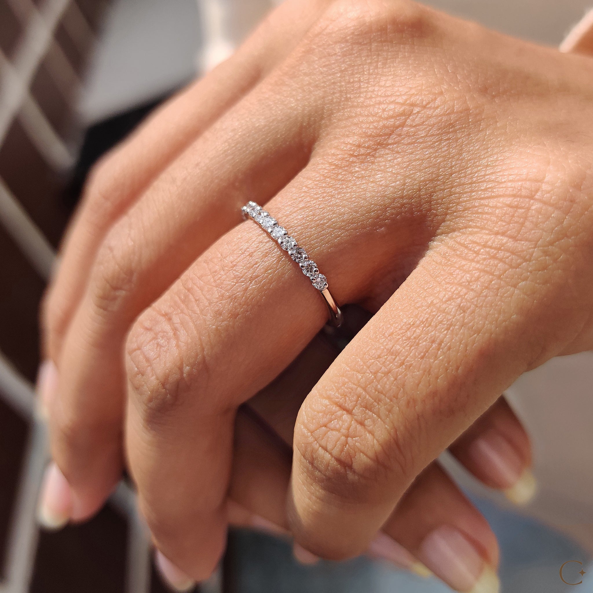 Prong set band featuring IGI certified lab diamonds.
