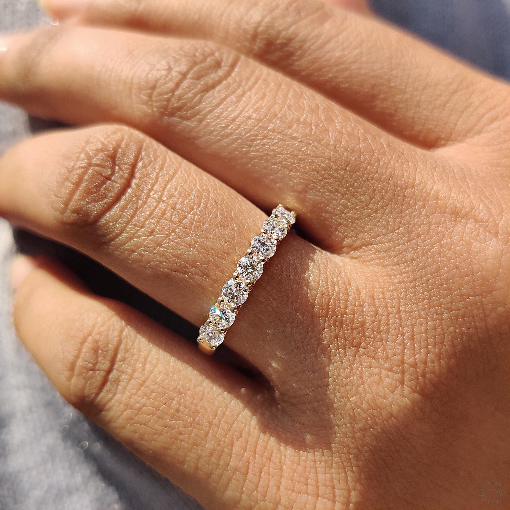 Lab grown diamond band featuring round brilliant stones.
