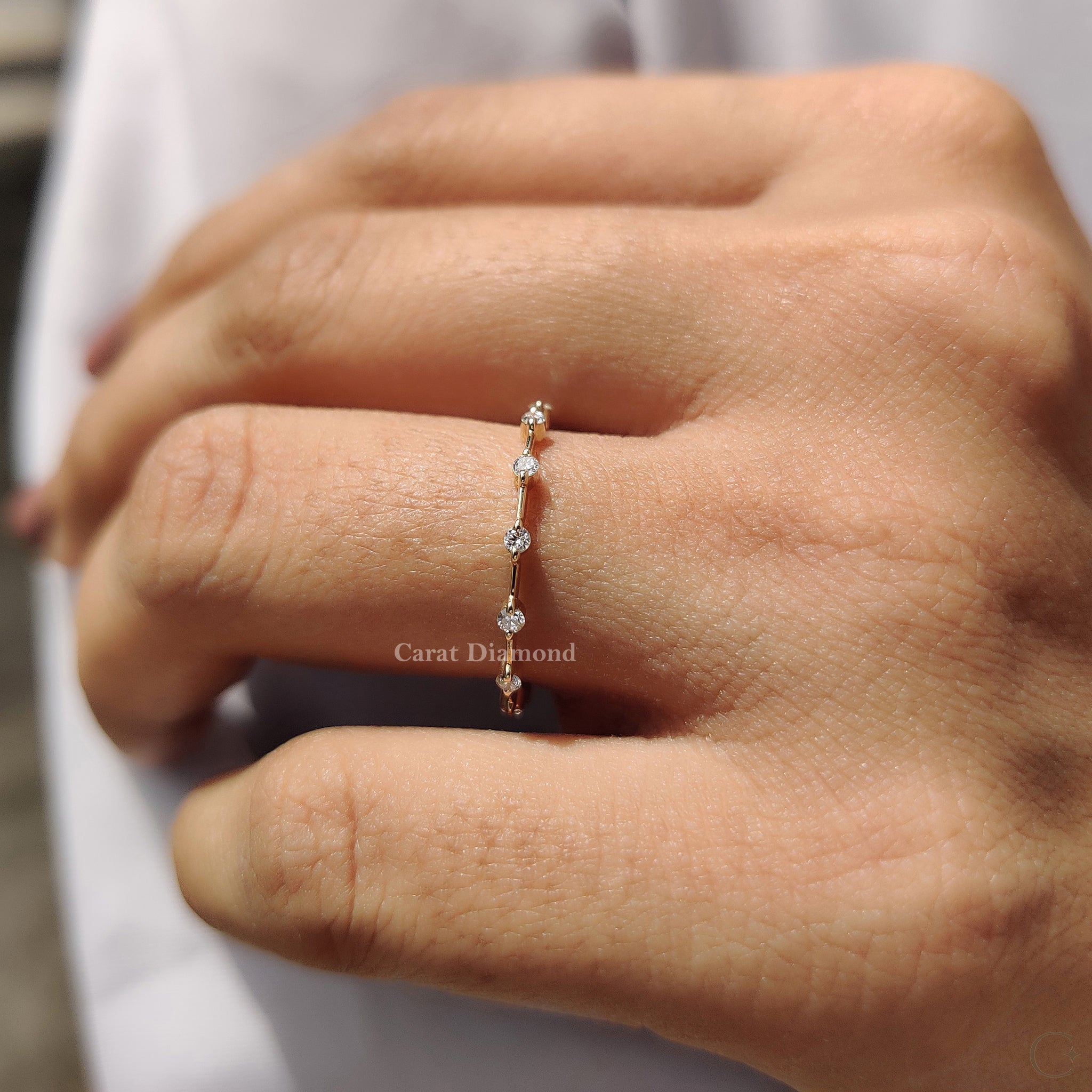 Round cut diamond set perfectly in a sleek band.
