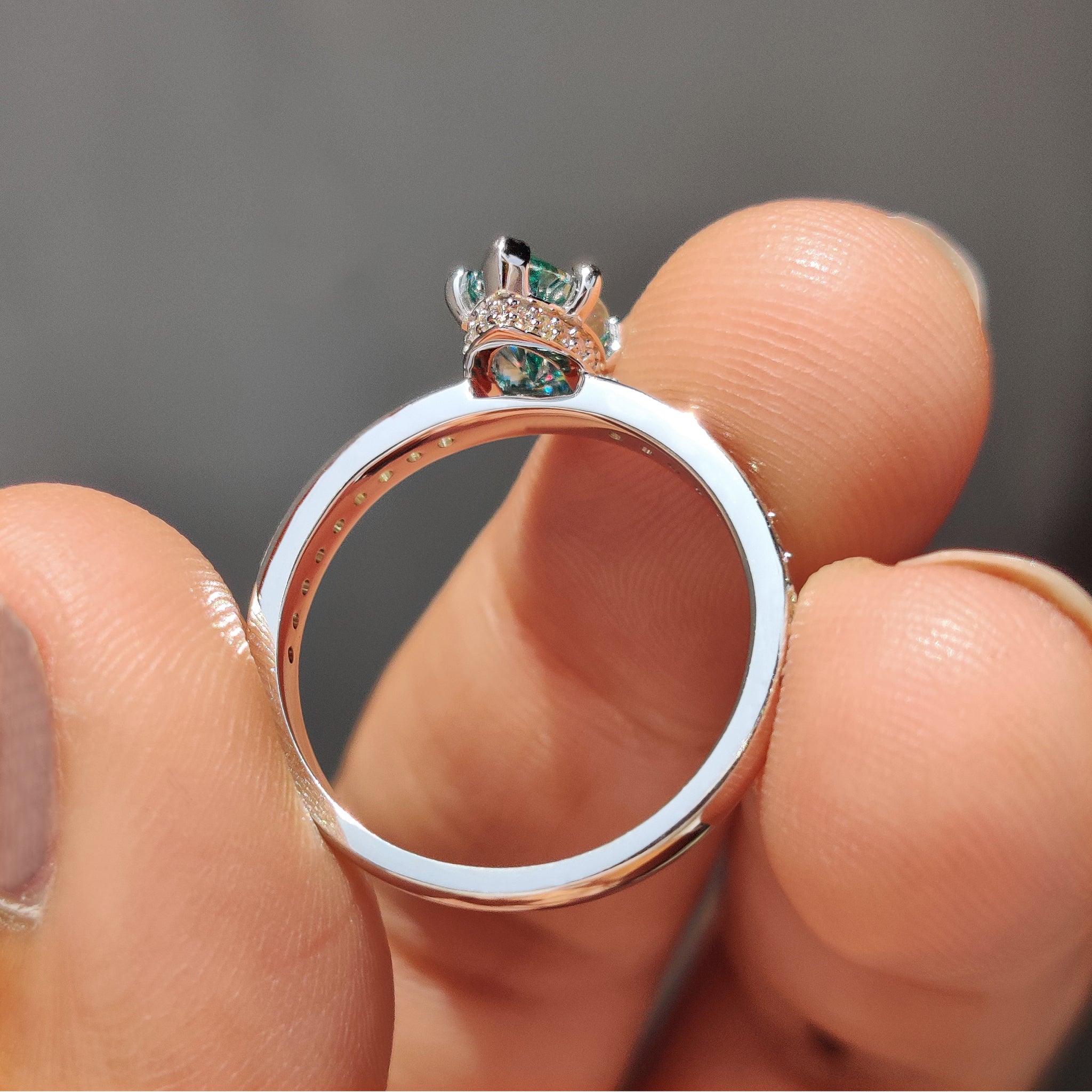 Pave set band on a marquise moissanite ring offering an intricate touch of detail.