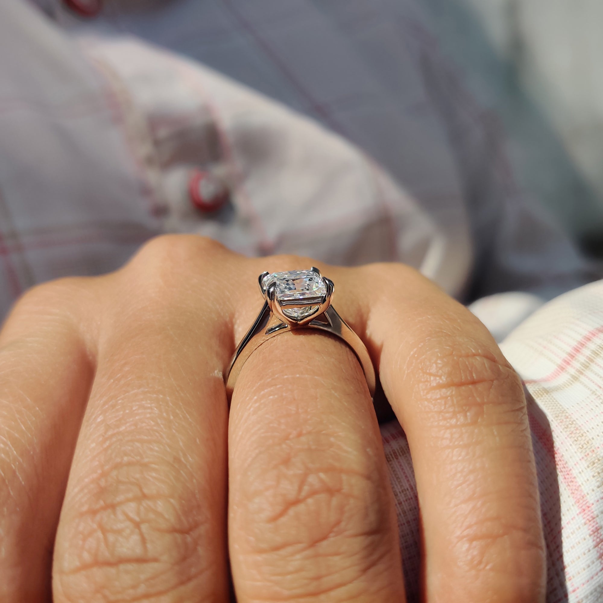 Princess cut solitaire ring with cathedral setting, ideal for a custom engagement ring style.
