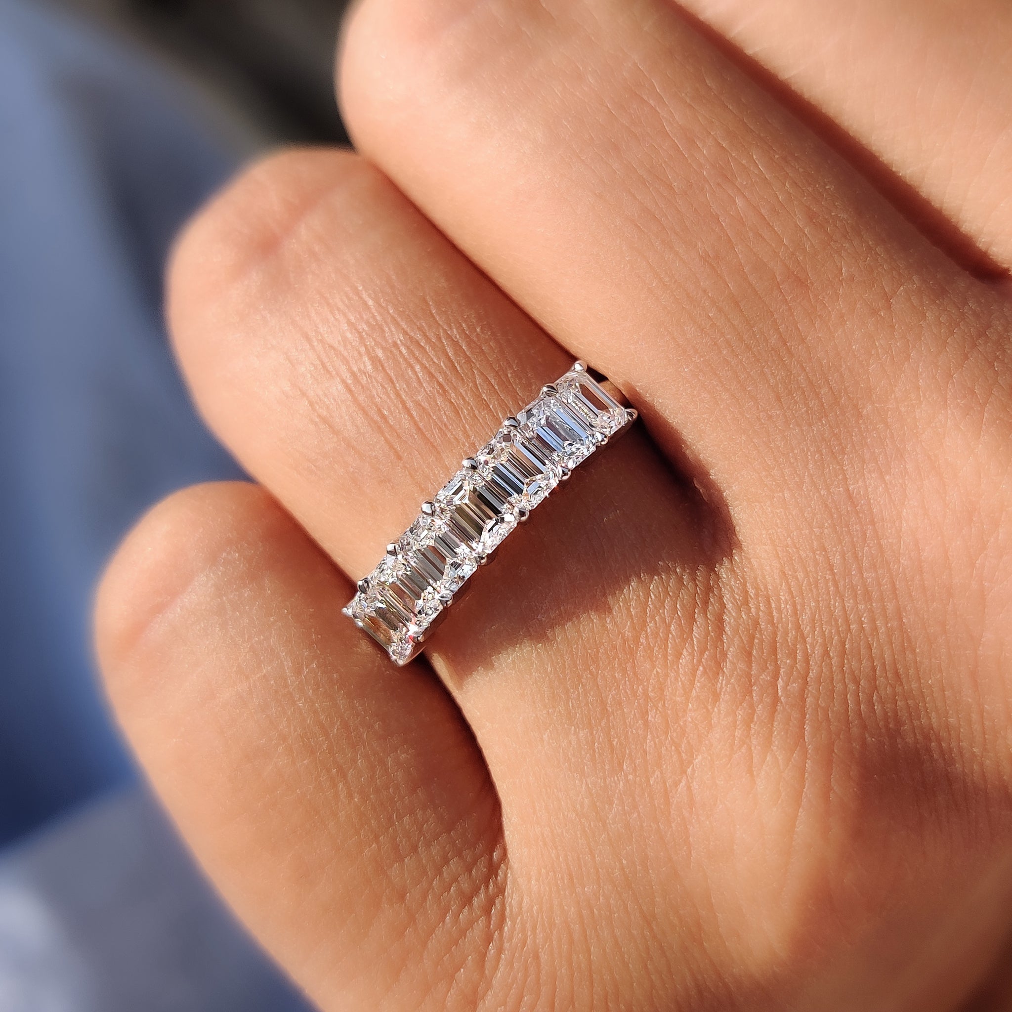 Carat Diamonds wedding band with an elegant emerald cut design.
