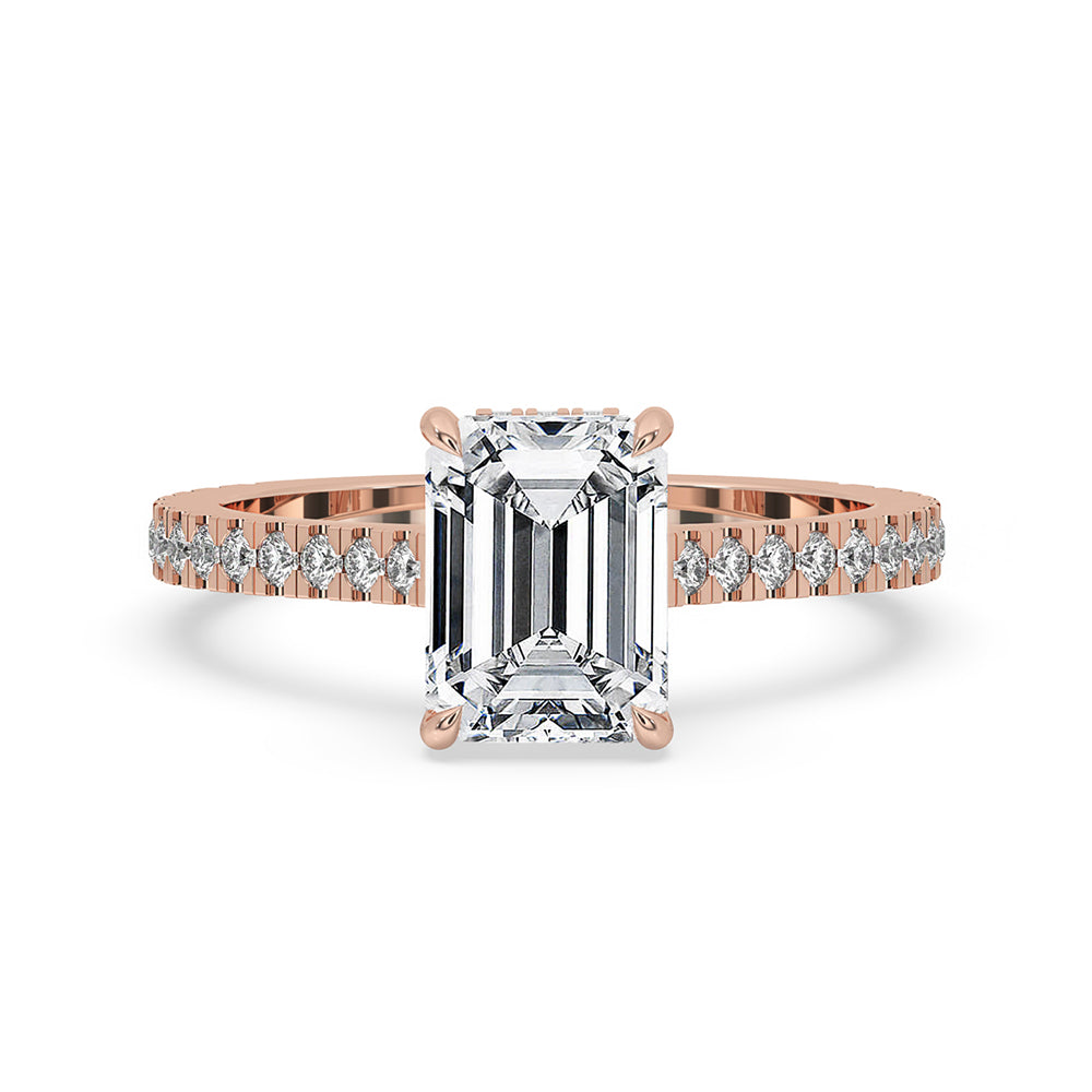 Elegant Emerald Cut Diamond Ring with a hidden halo setting, featuring a pave diamond band and claw prong setting for a sophisticated look.
