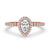 Pear shaped halo engagement ring with a pave diamond band, featuring lab grown diamonds.