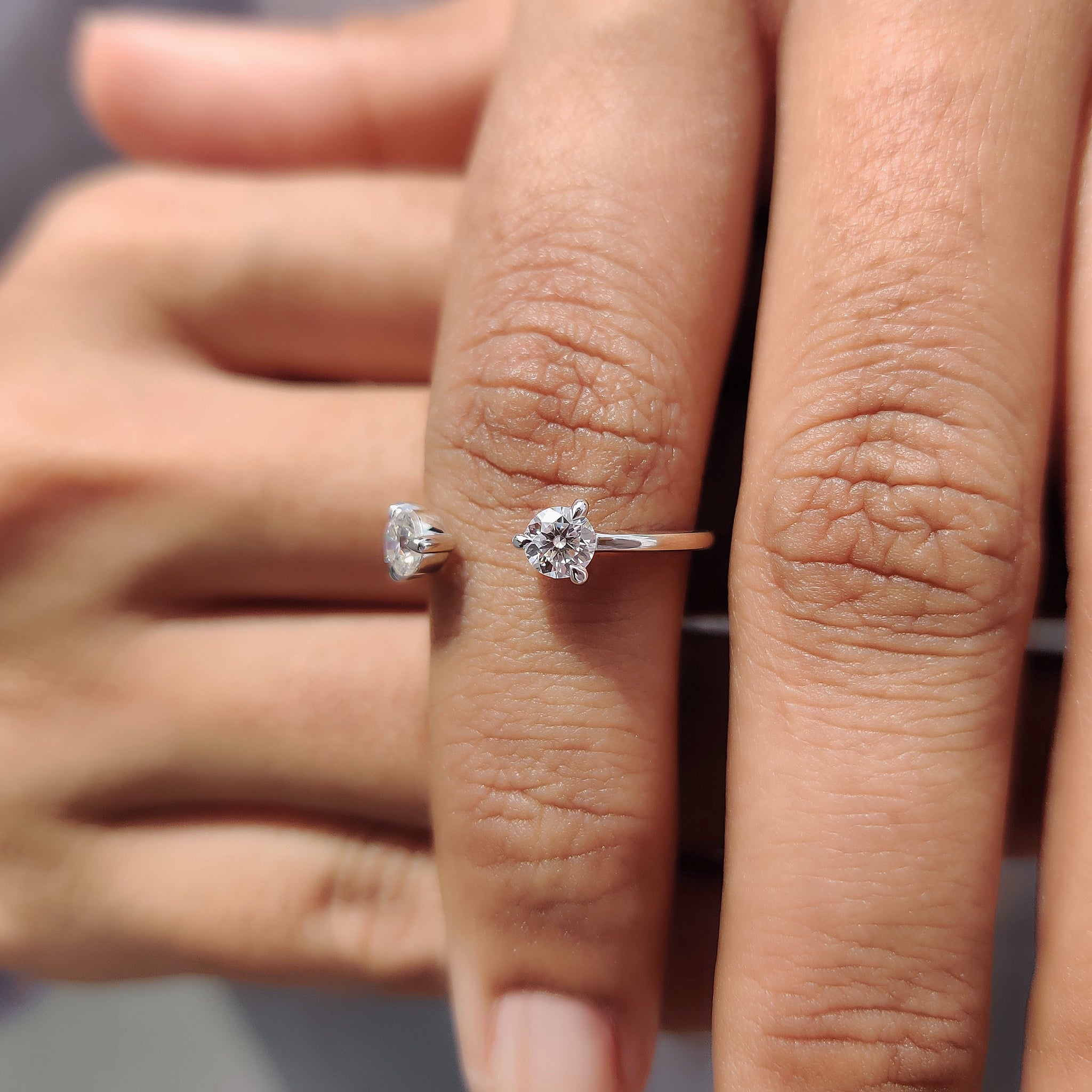 wedding band featuring an open design and handcrafted prong settings.
