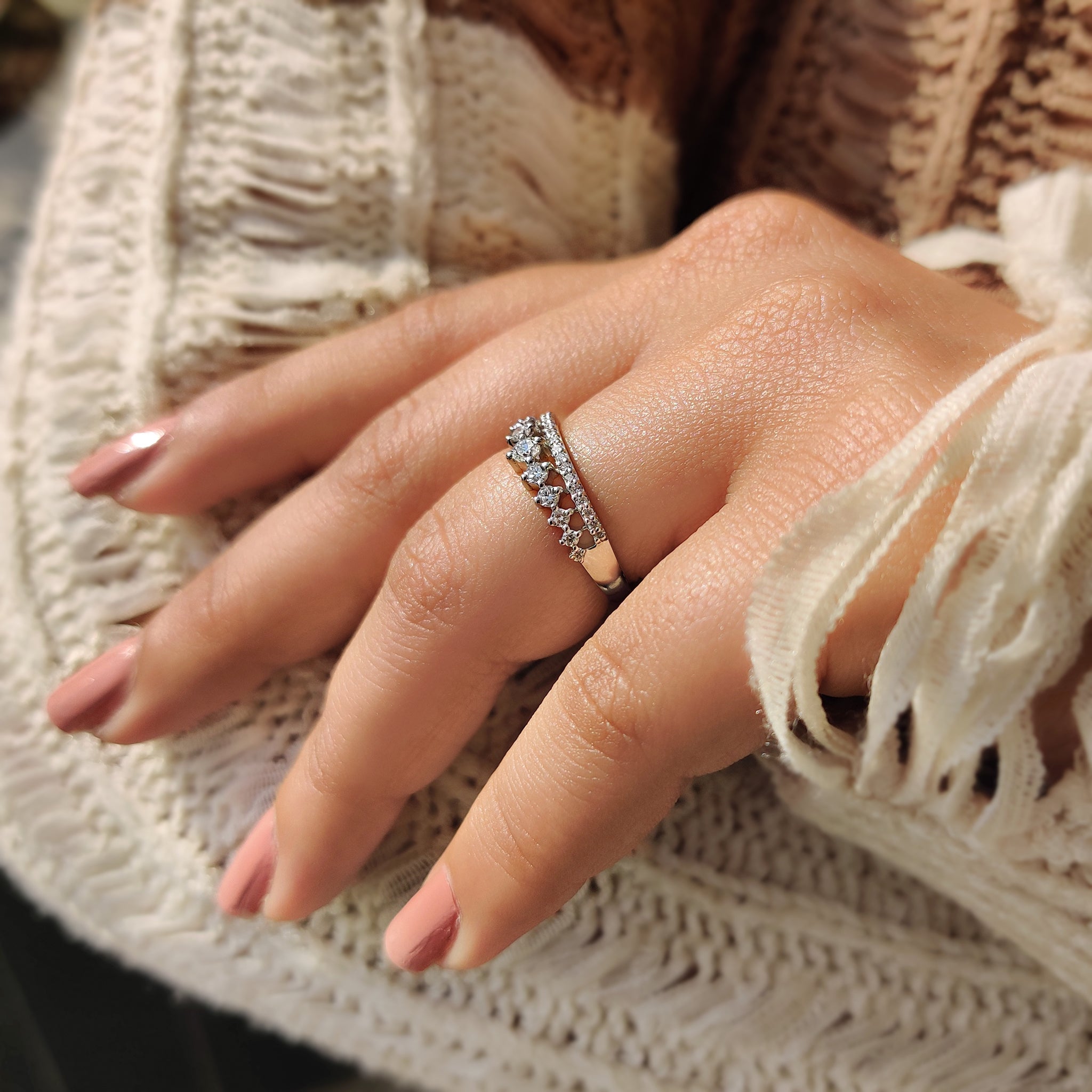 Close-up of round cut diamonds perfectly set in a band.
