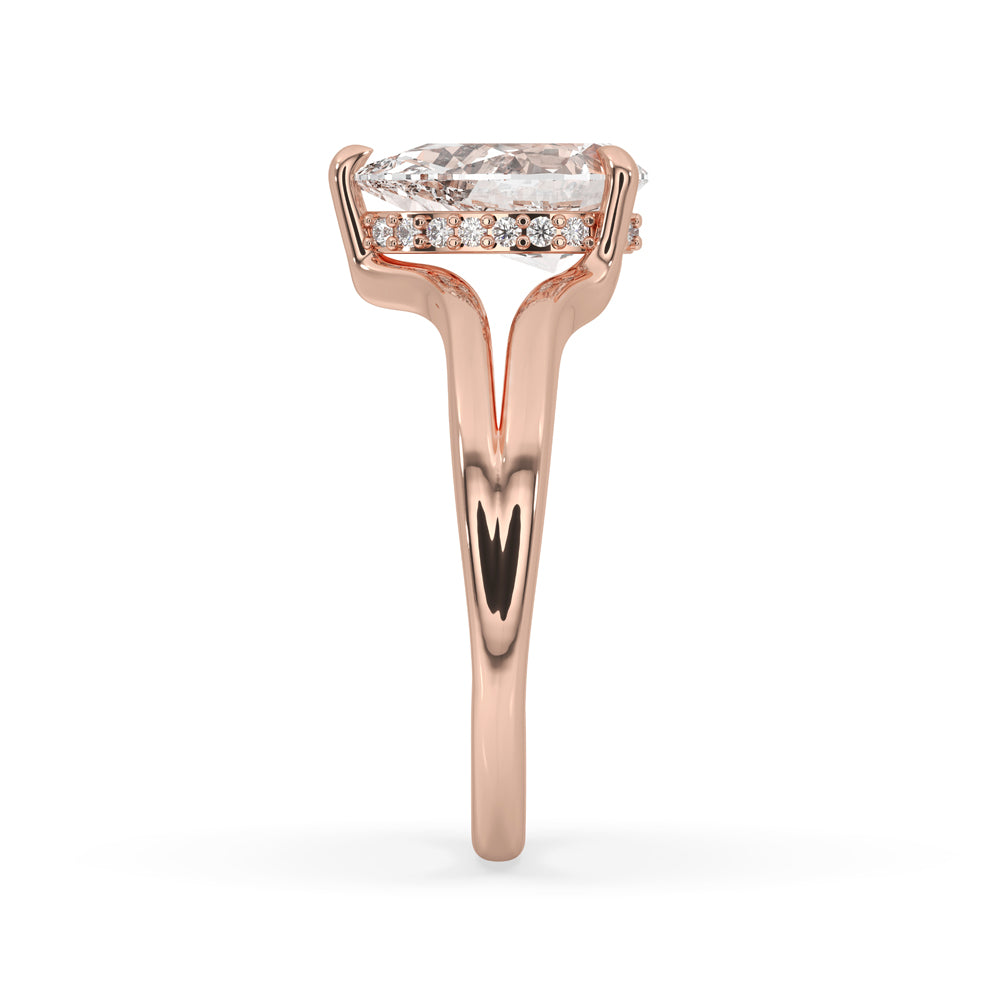 Rose gold diamond ring with a unique split shank design.
