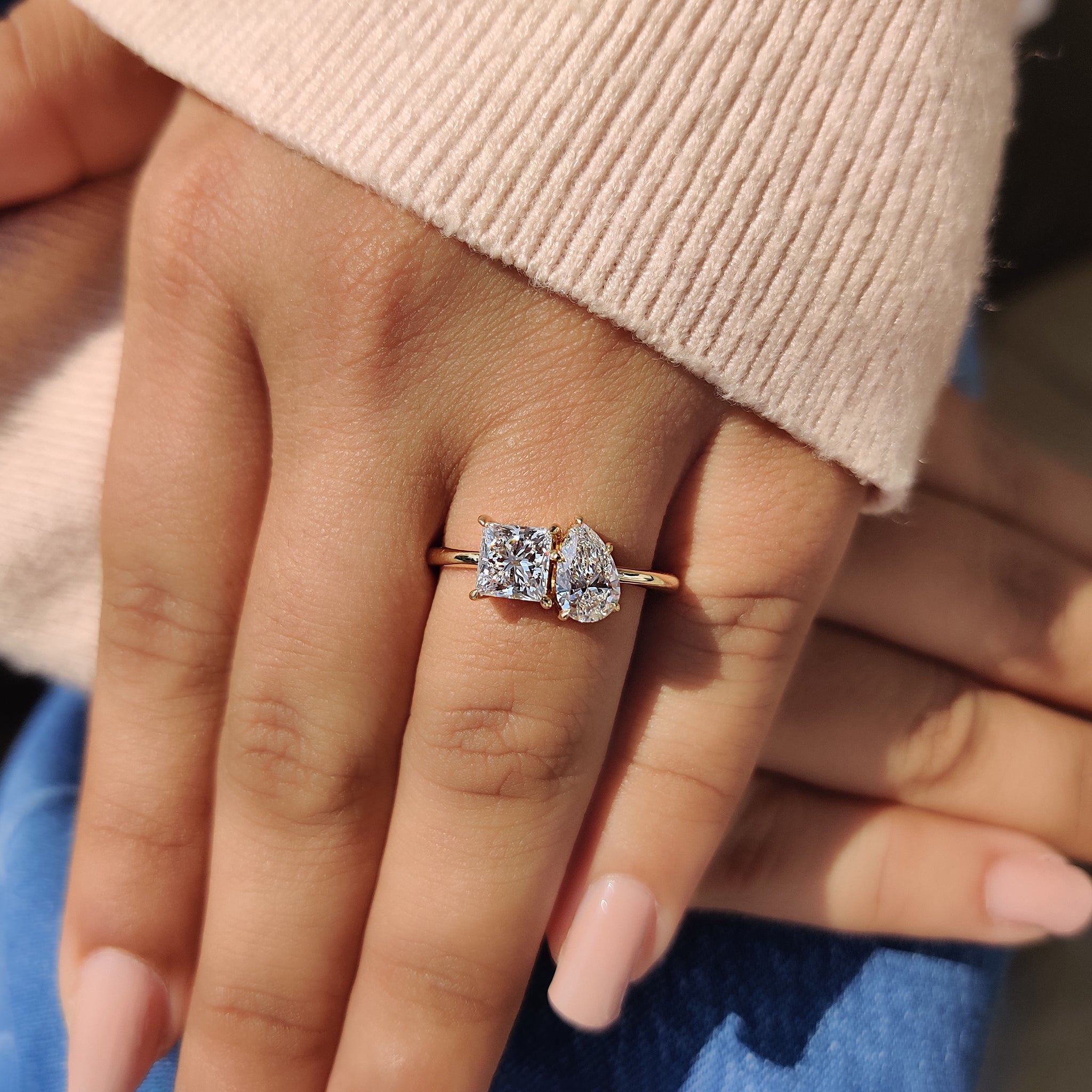 An elegant toi et moi engagement ring lab grown, made with igi certified diamonds and a handmade yellow gold band.
