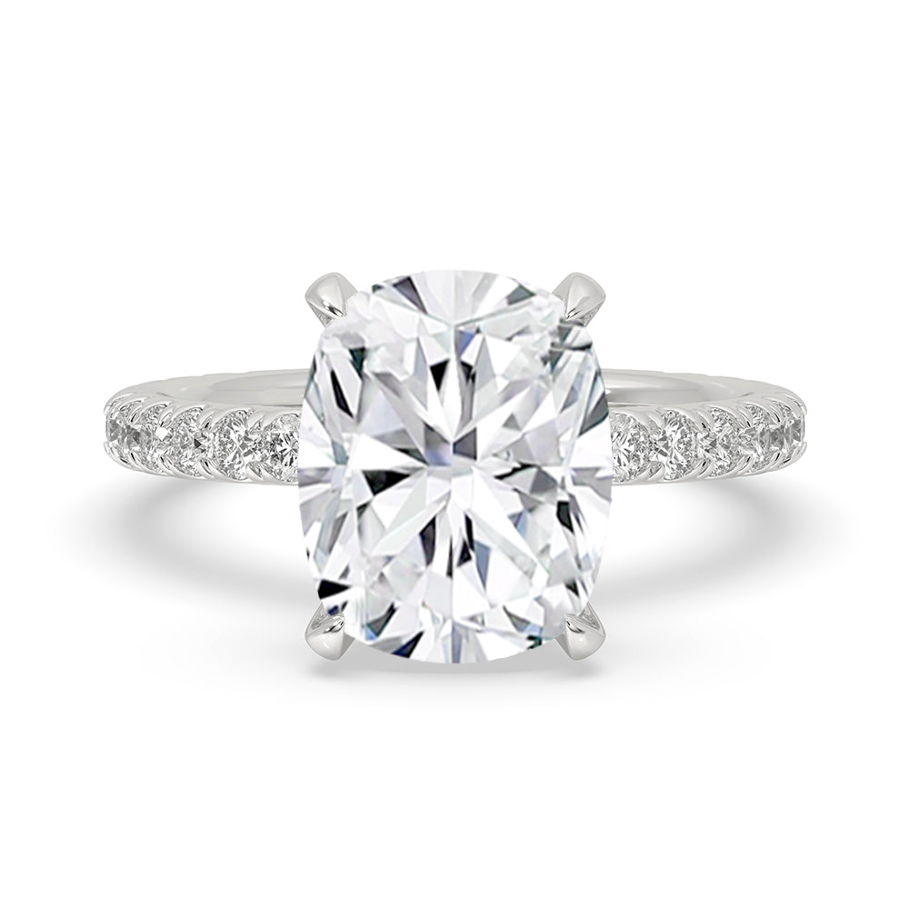 Elongated cushion engagement ring in a hidden halo setting.