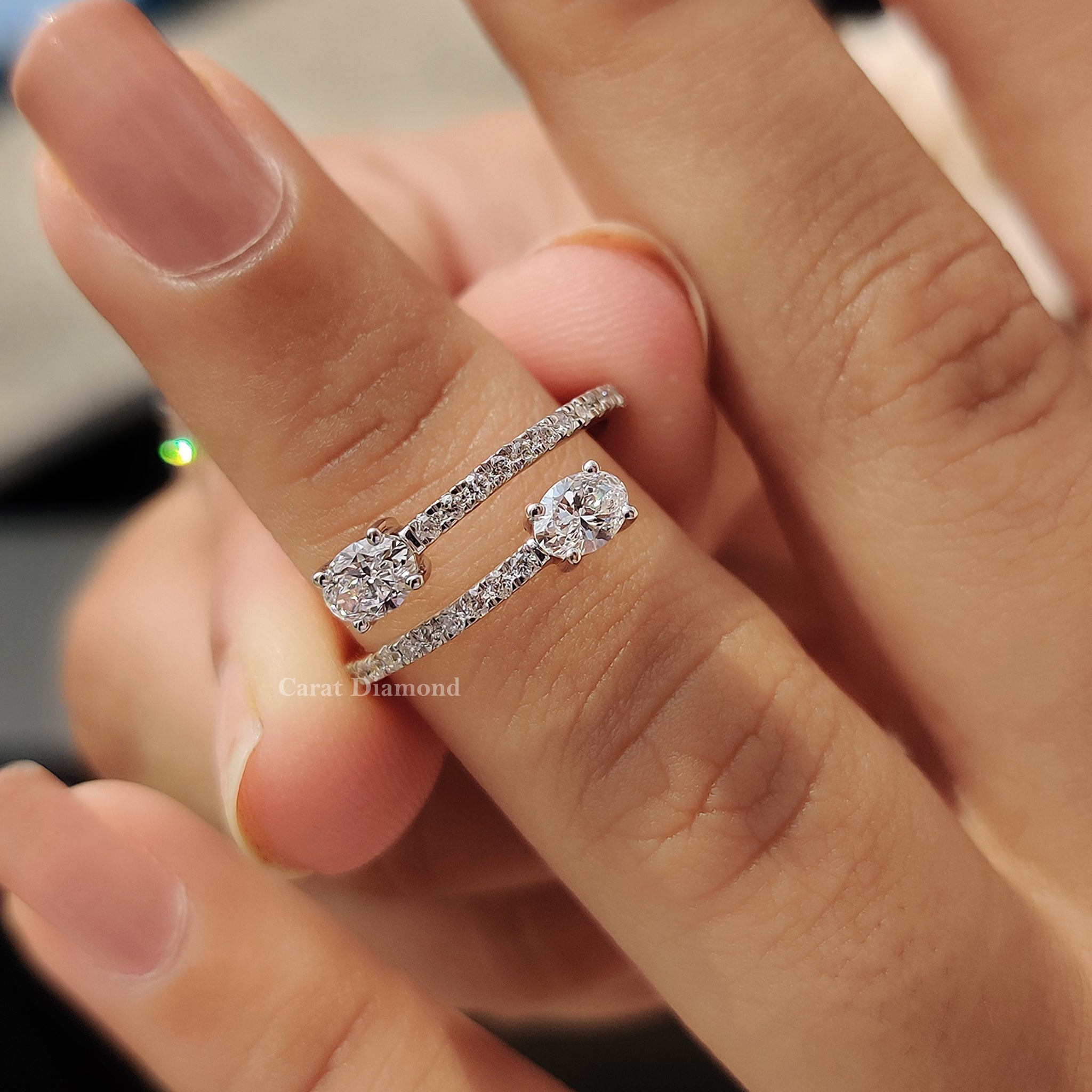 Round cut pave band highlights smaller stones on the curved band.
