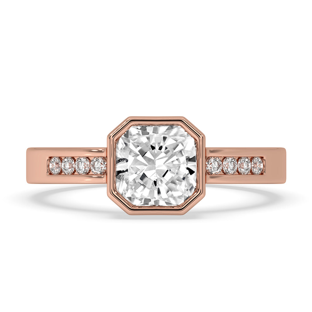 Cushion cut diamond engagement ring with bezel setting ring.