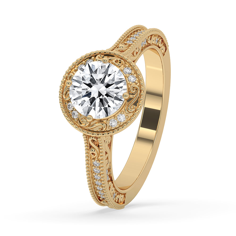 Milgrain engagement ring featuring round cut diamonds in yellow gold.
