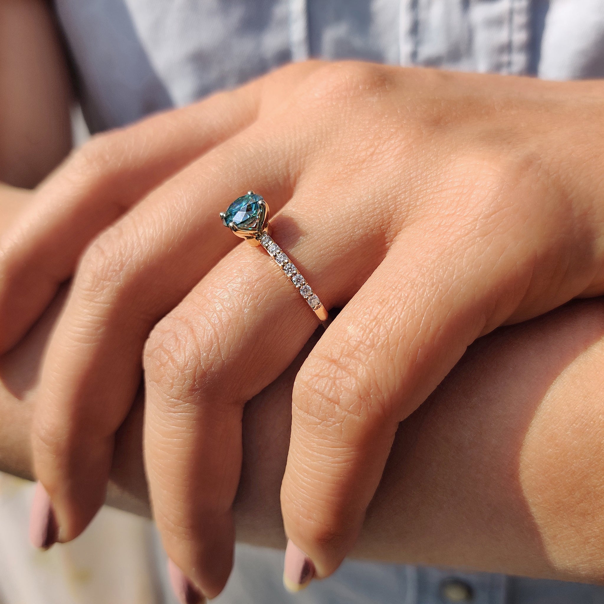 The carat diamonds engagement ring pairs perfectly with a cyan blue moissanite ring for a unique style.

