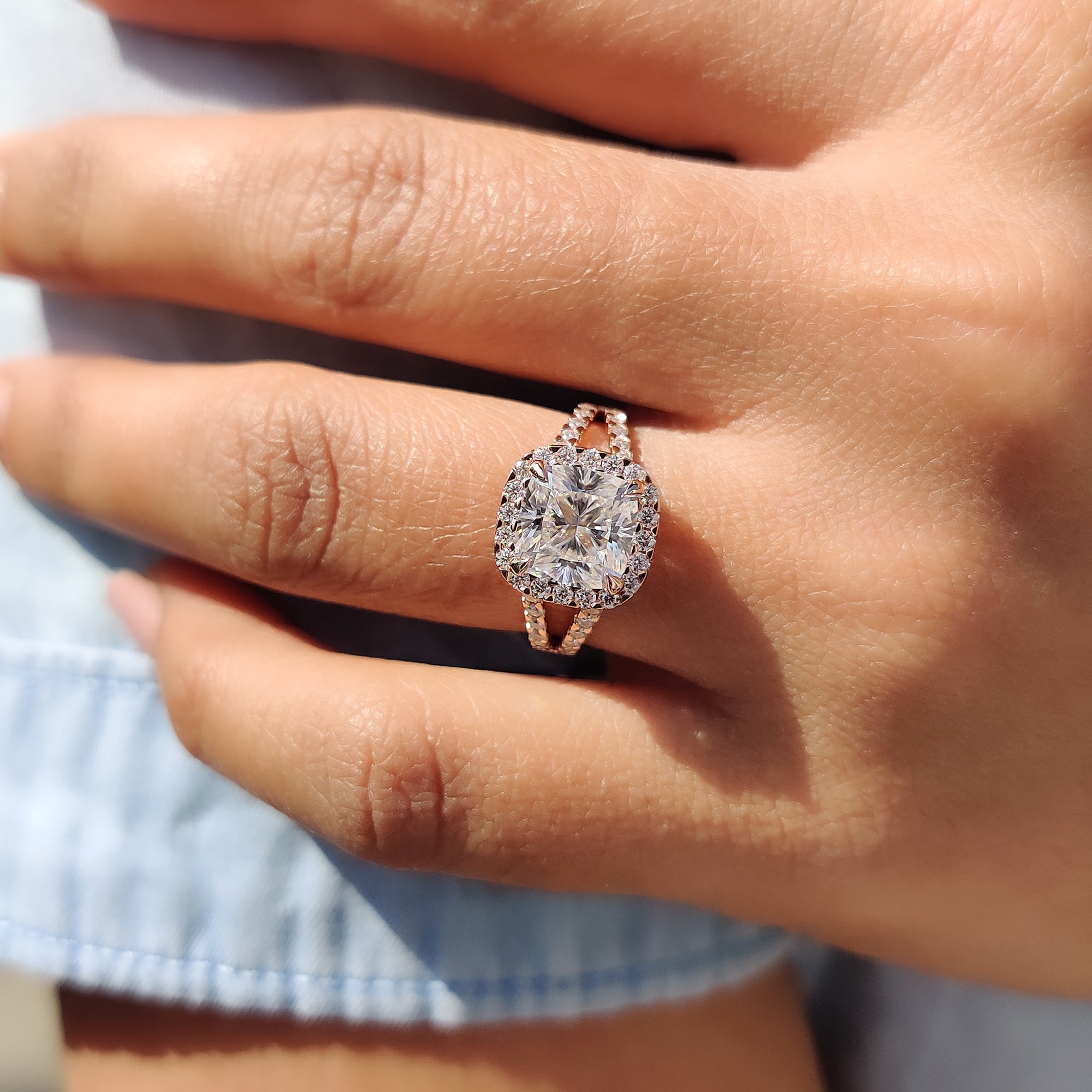Unique engagement ring with a round cut split pave set band and center, perfect for a heartfelt proposal ring.
