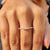 Marquise shape outline band featuring a white gold wedding band.
