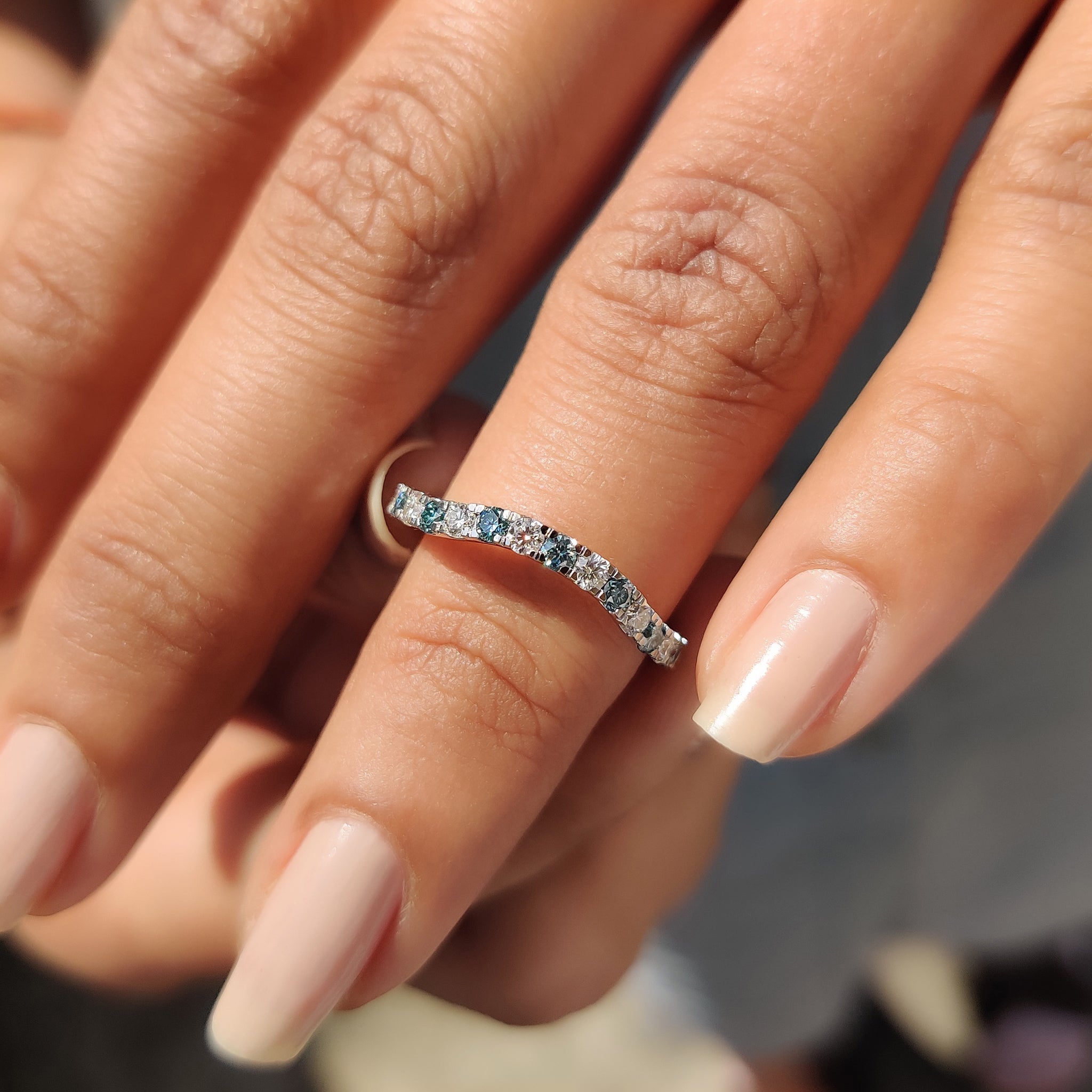 Cyan blue stone band set in white gold, perfect for a modern wedding.