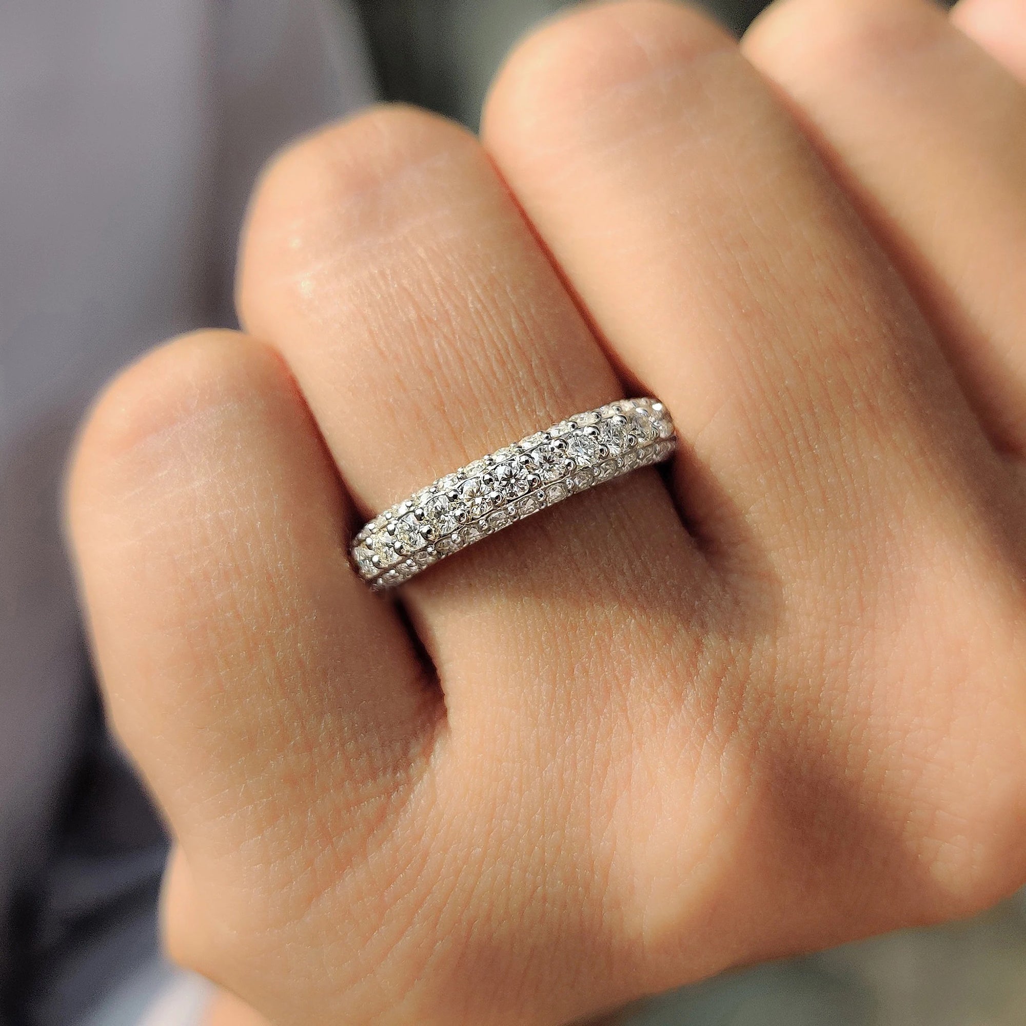 Moissanite wedding band offers lasting beauty.
