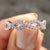 Twisted wedding band crafted with a graceful twist design.
