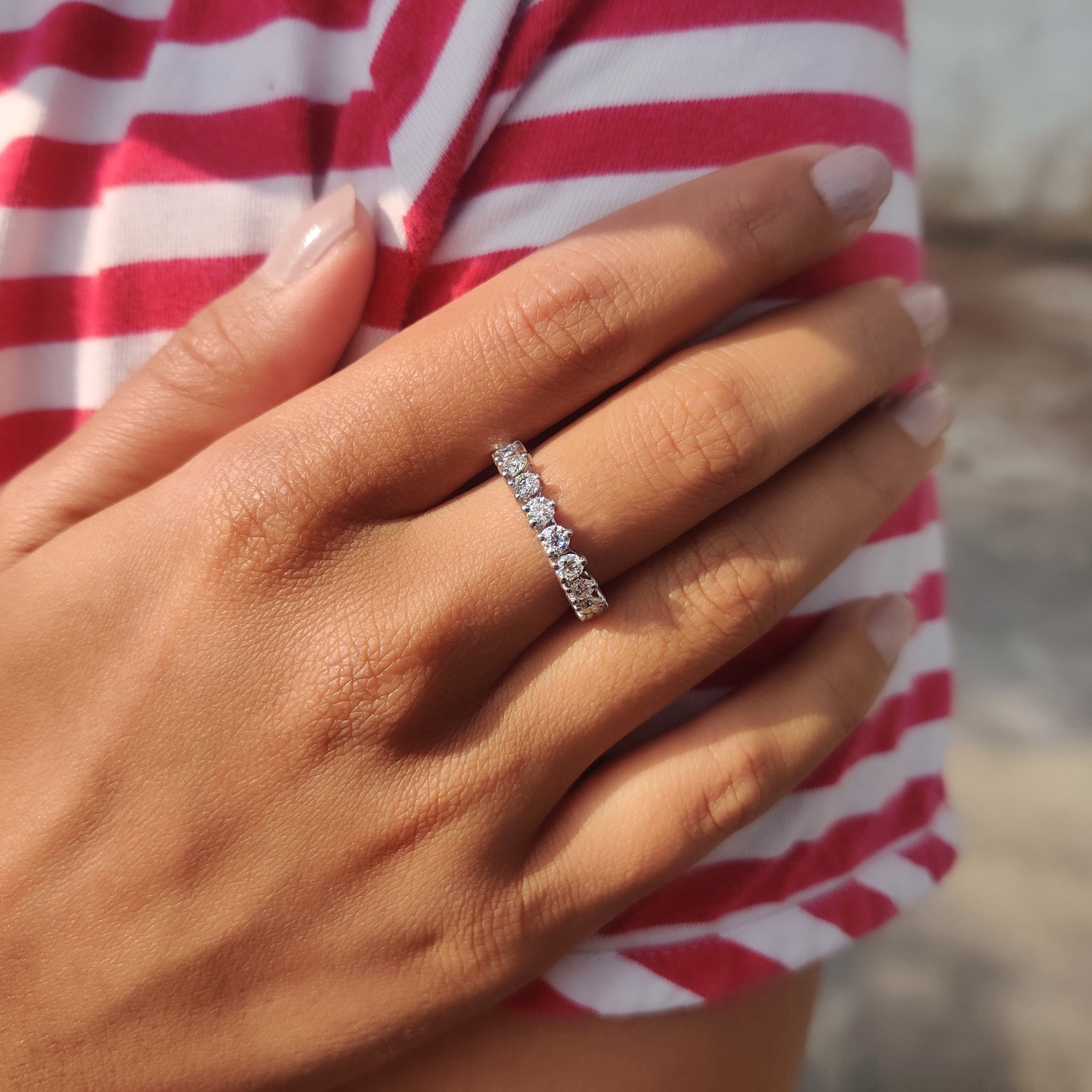 Custom wedding band available in white gold with your choice of moissanite cut and setting.