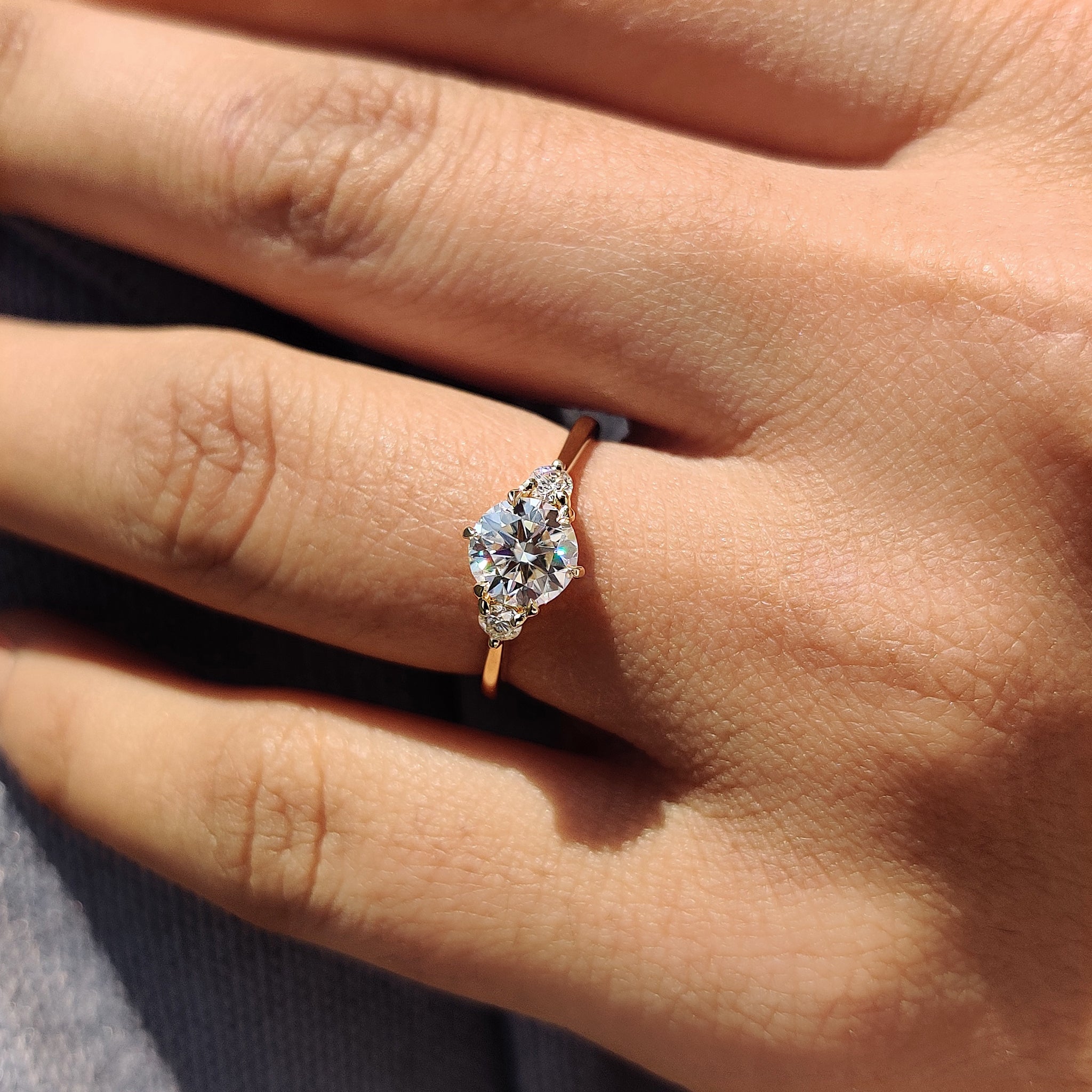 3 stone round engagement ring with round cut Moissanite, perfect for custom designs.
