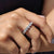 Elegant round moissanite wedding band crafted with precision in white gold.