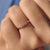 Bezel set diamond band with a sleek, modern design.
