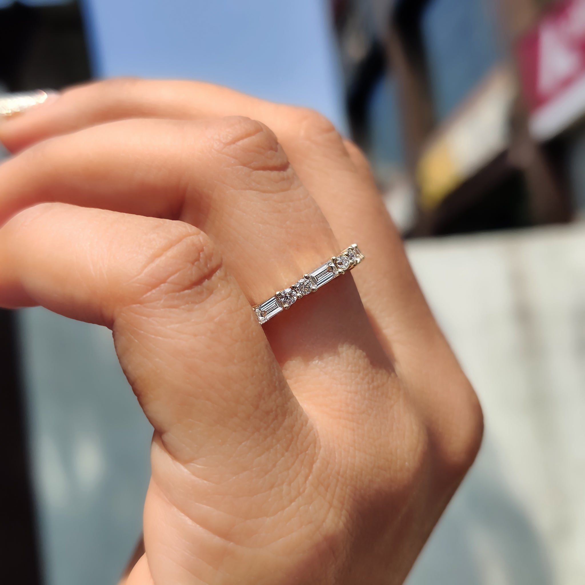 Prong setting band showcasing brilliant diamonds.
