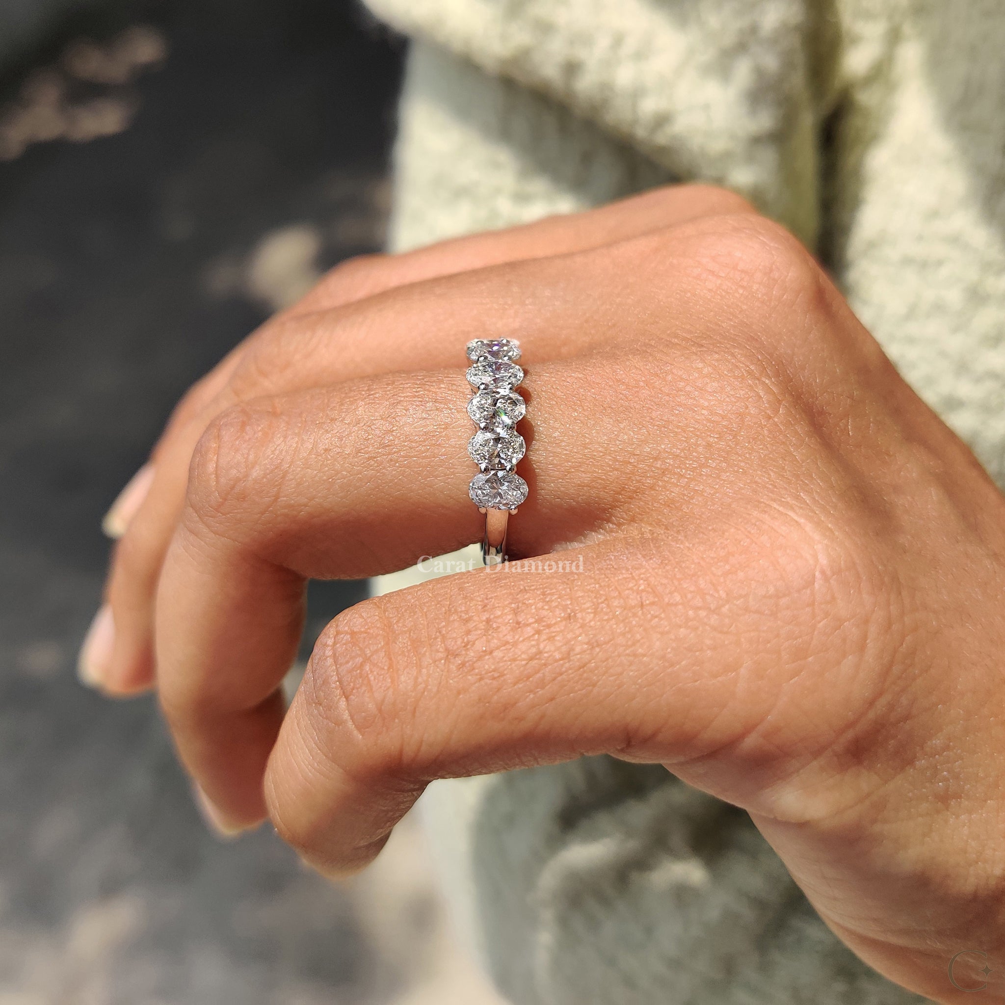 7 stone diamond band set in white gold.
