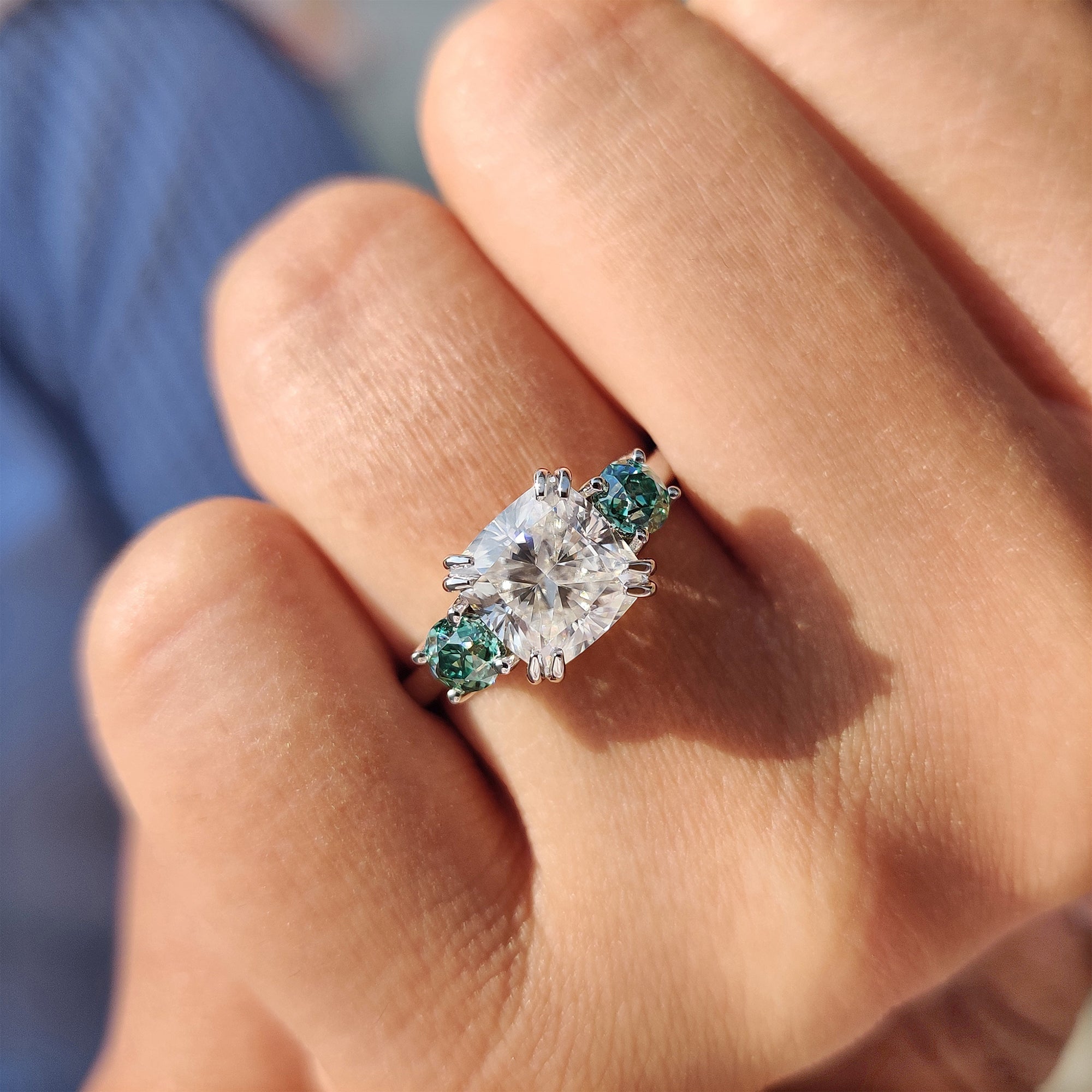 Moissanite cushion cut ring with double claw prong setting.
