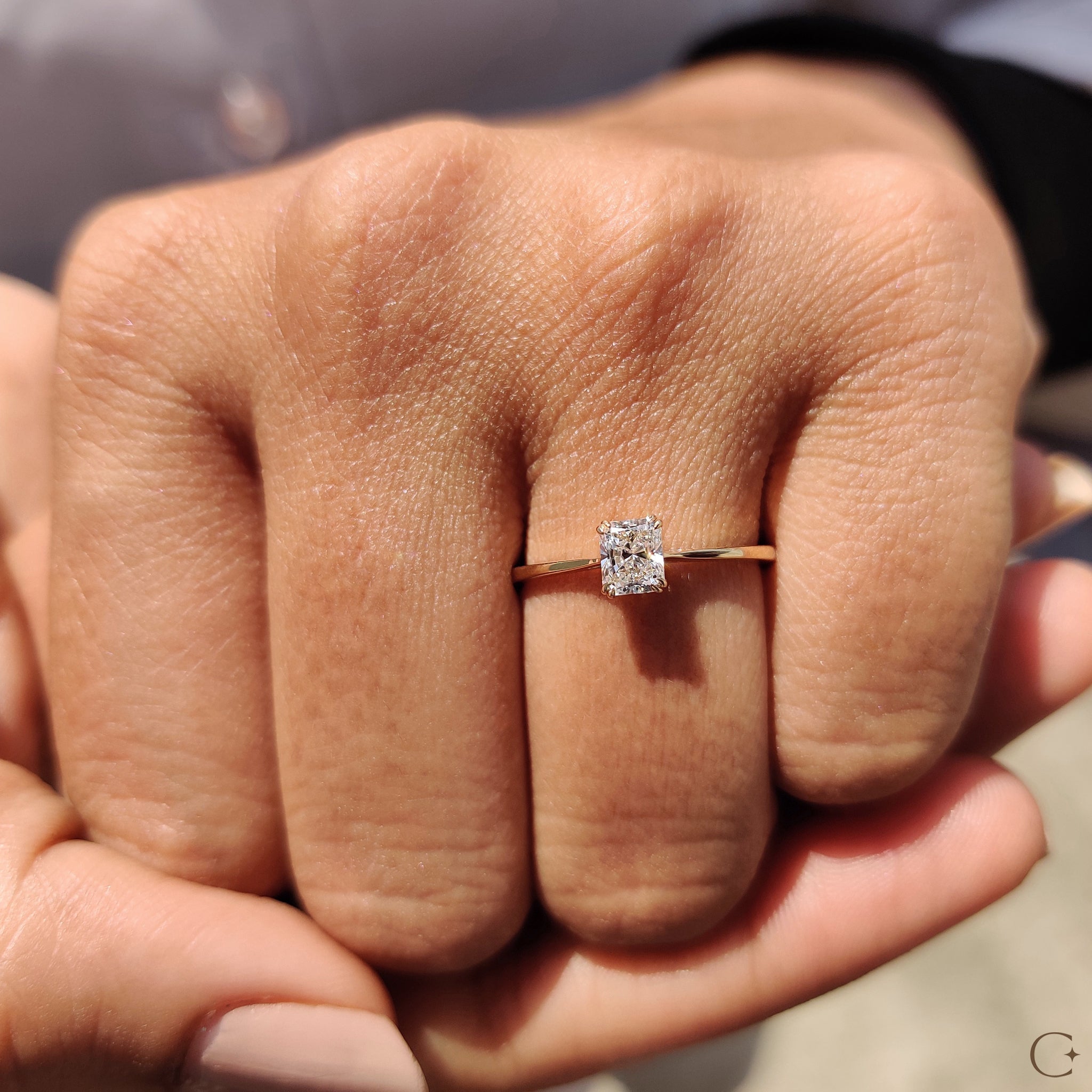 Handmade jewelry with radiant cut diamond and tapered shank ring.