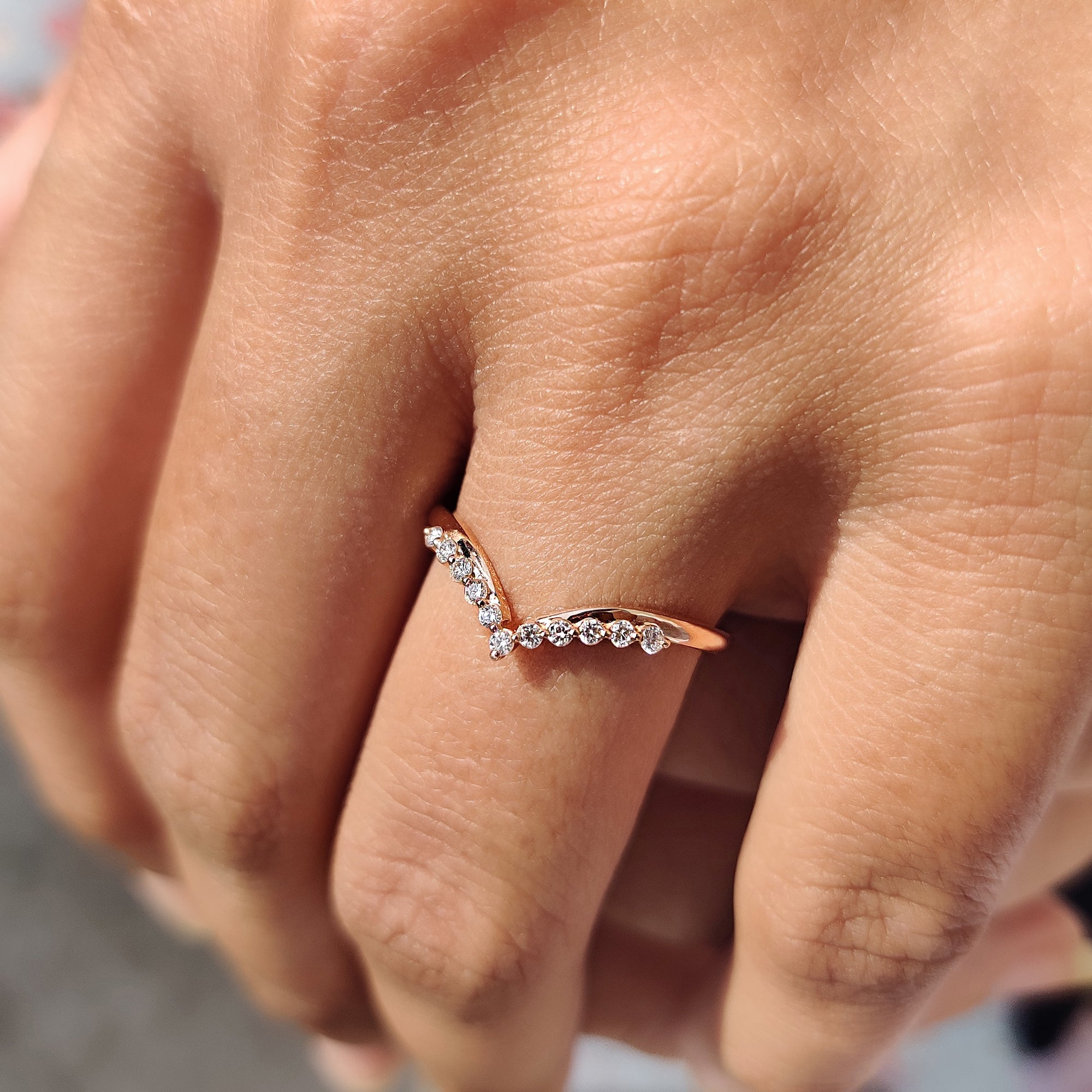 Handmade jewelry wedding band crafted in white gold with moissanite stones.