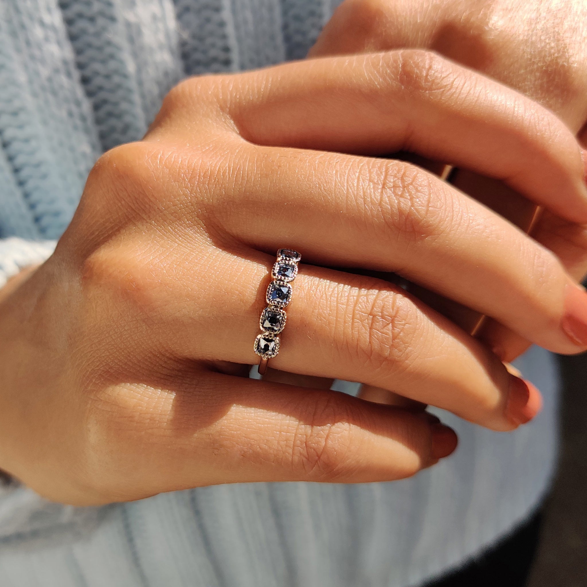 White gold anniversary band with custom blue stones.