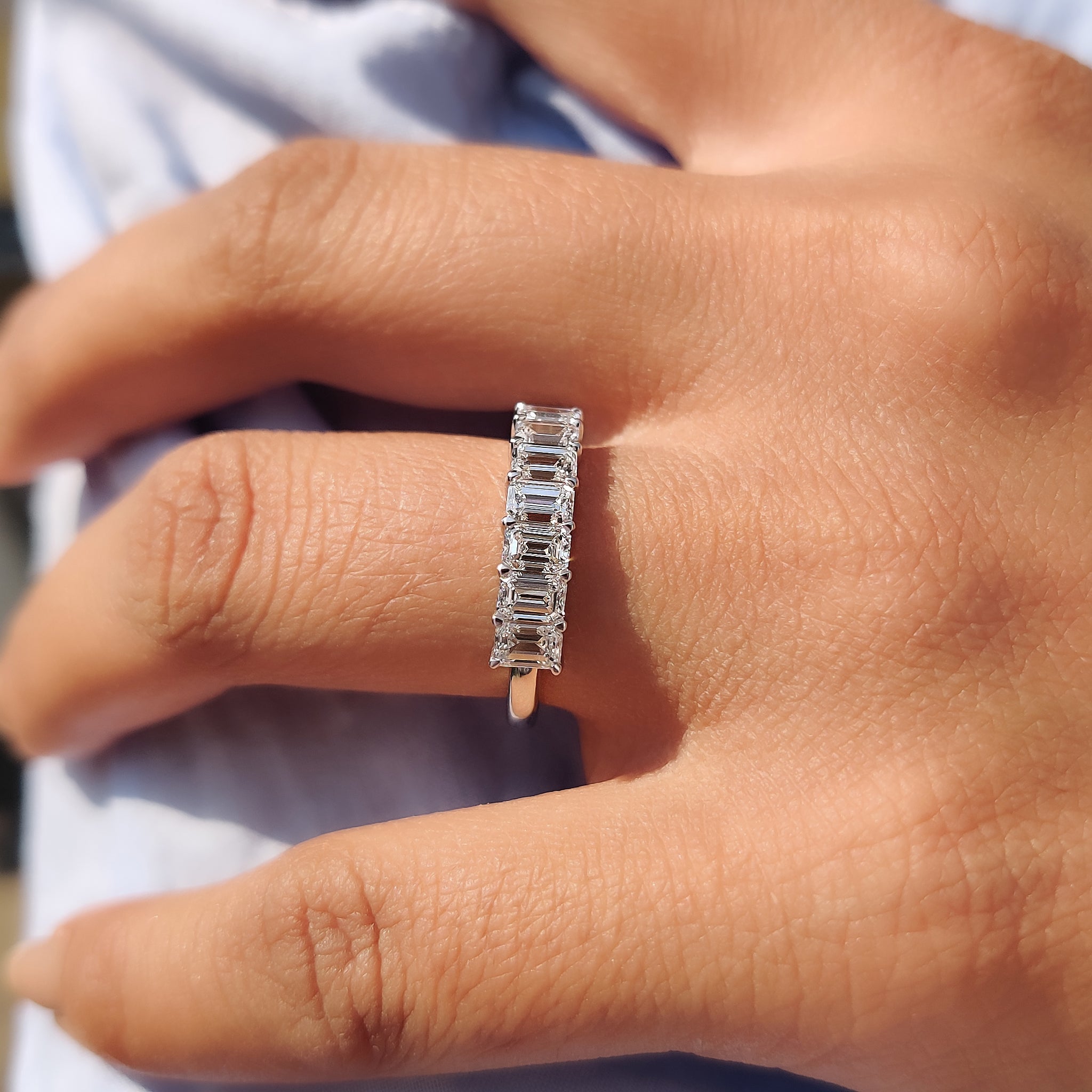 Stunning prong set white gold wedding band with round diamonds.
