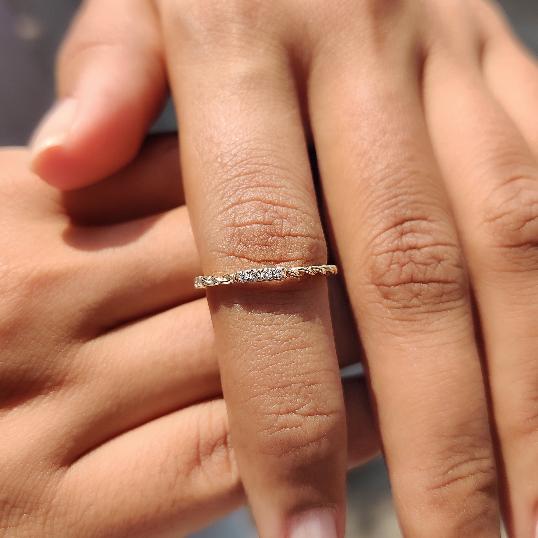 Carat Diamonds wedding band with twisted pavé setting.