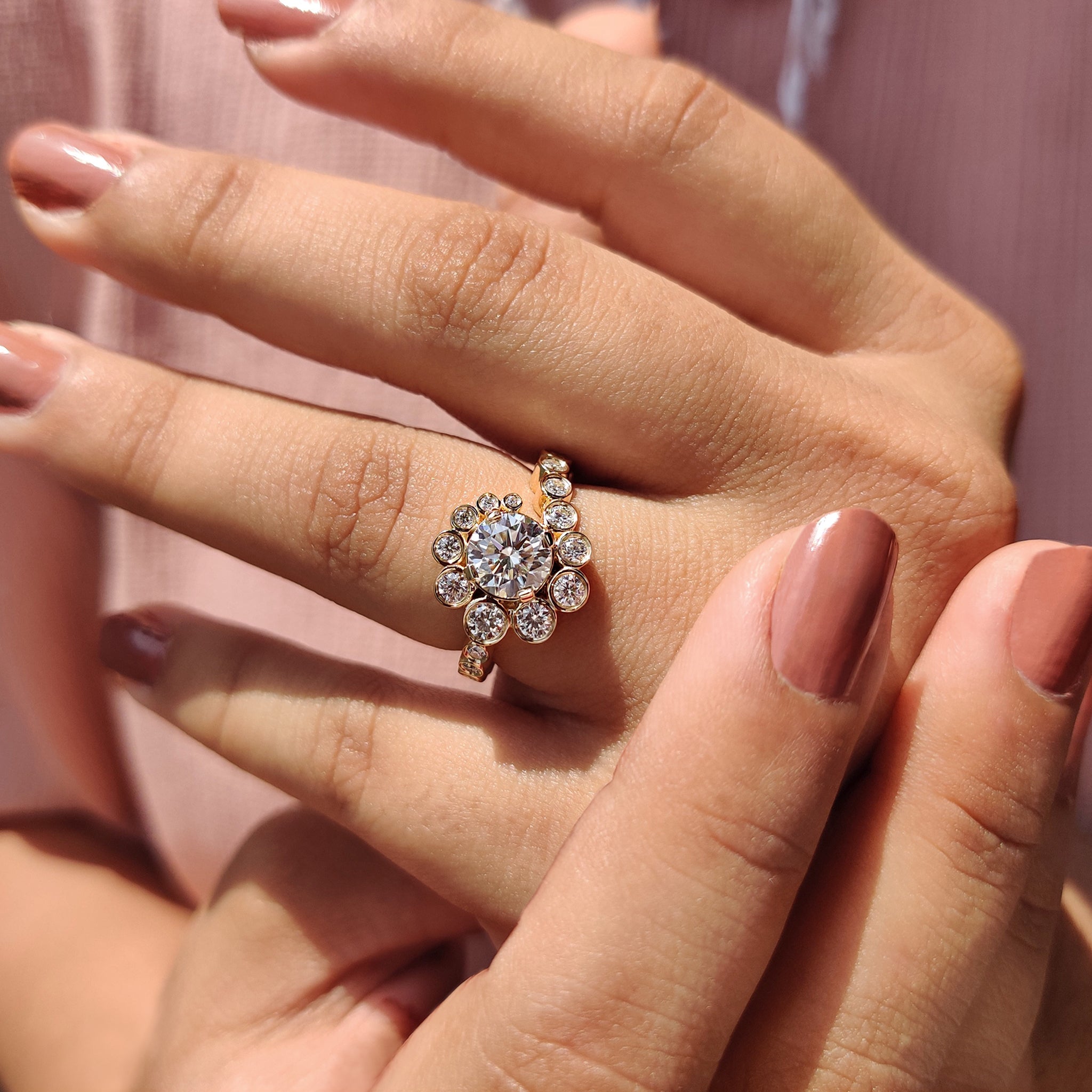 Bezel Setting engagement ring featuring a round cut moissanite for a modern design.
