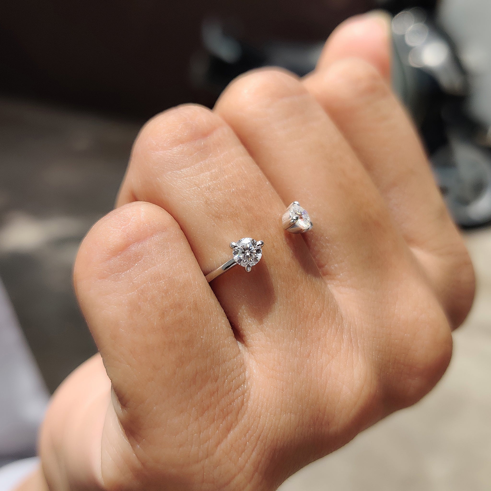  wedding band featuring an open design and handcrafted prong settings.
